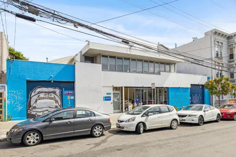 a front view of a house with parking space