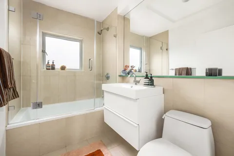 a bathroom with a sink a toilet and a bathtub