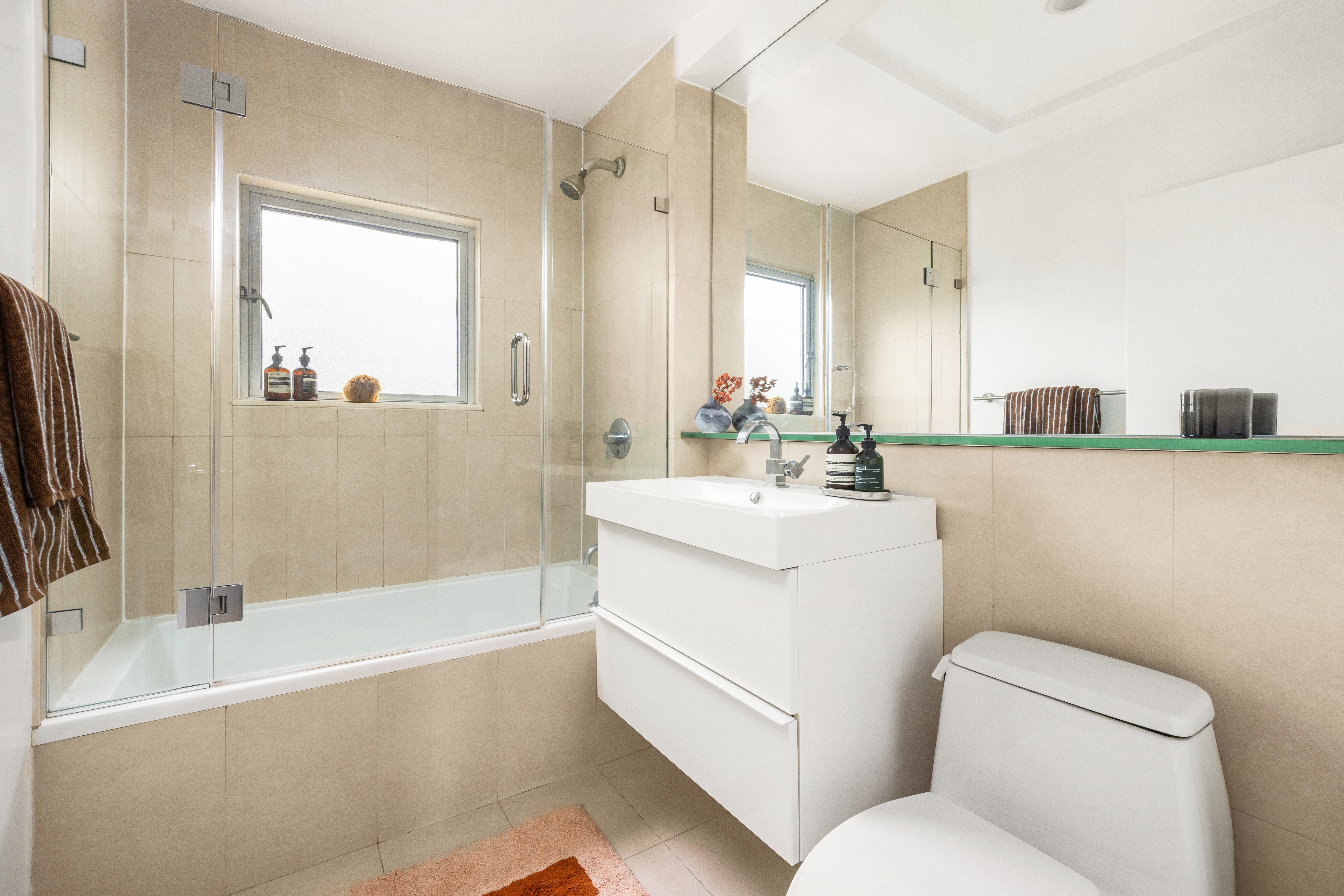 297 Driggs Avenue, Unit 4A Brooklyn, NY 11222 - Photo 8 of 9 a bathroom with a sink a toilet and a bathtub