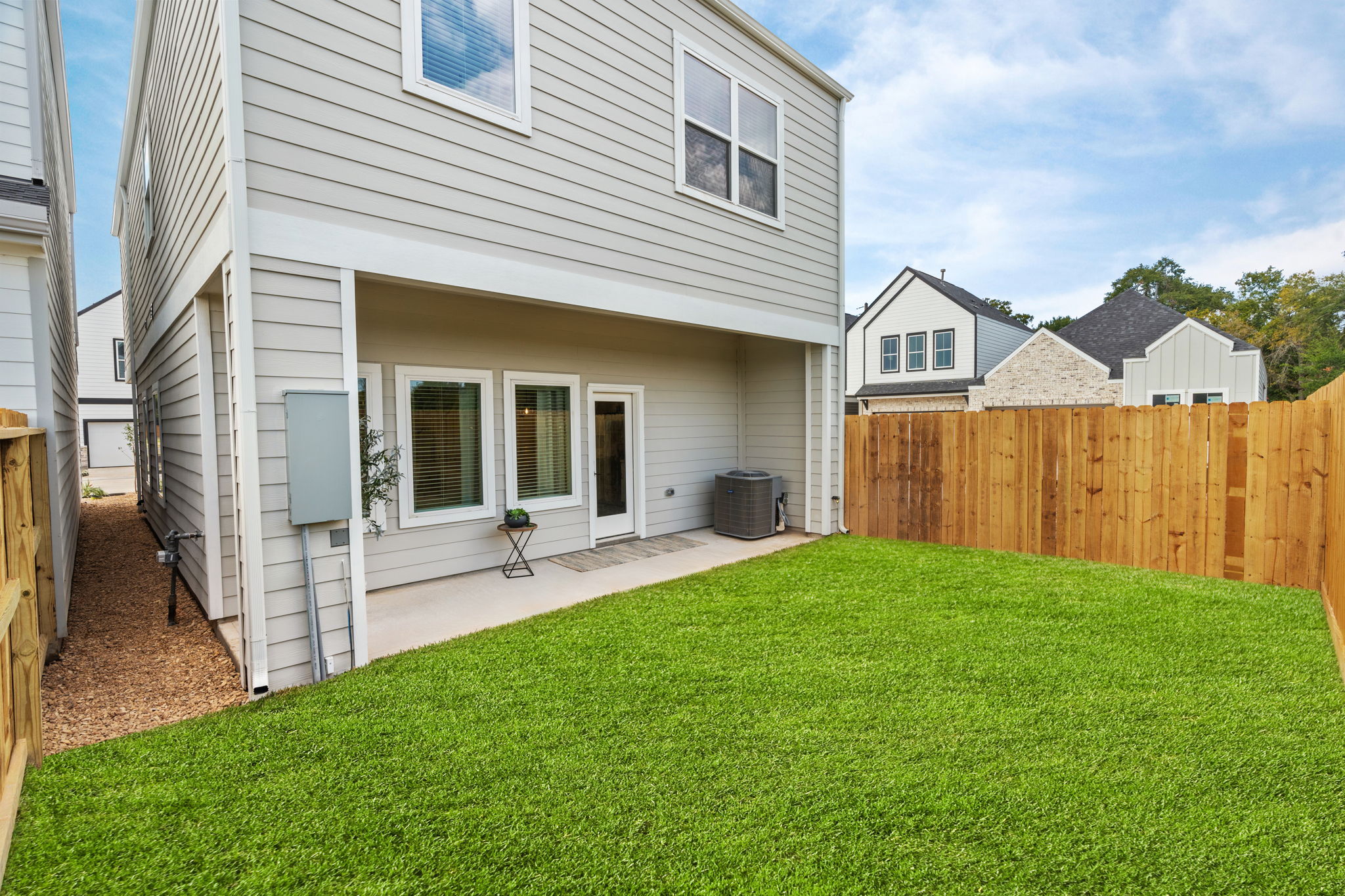 11303 Stonework Grv Lane Houston, TX 77076 - Photo 34 of 39 a view of a house with a yard and porch