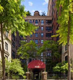 a view of a red brick building under an umbrella