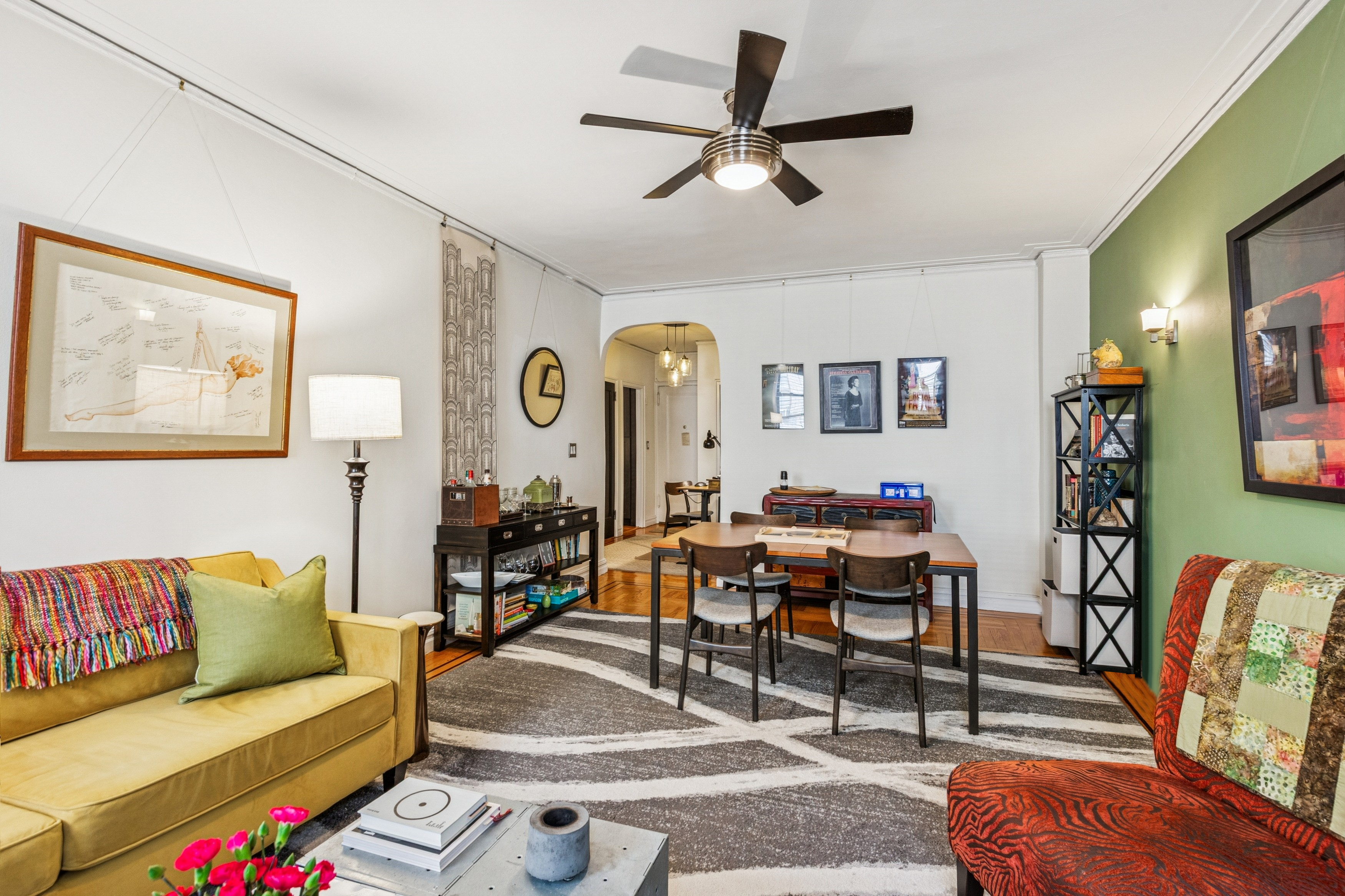 60 Cooper Street, Unit 5J Manhattan, NY 10034 - Photo 3 of 17 a living room with furniture and wooden floor