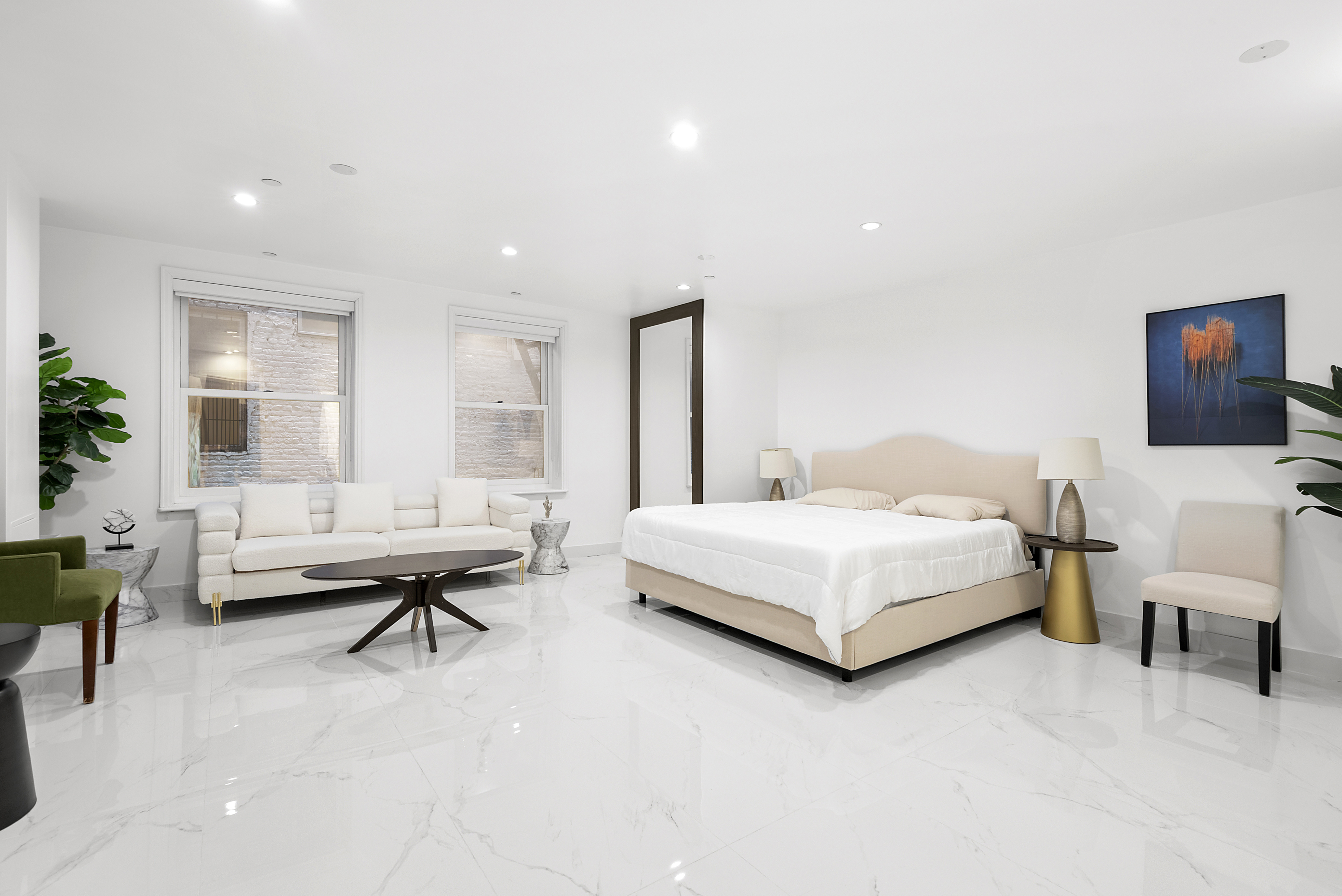 53 Murray Street, Unit 1 Manhattan, NY 10007 - Photo 7 of 15 a bedroom with a bed and a couch