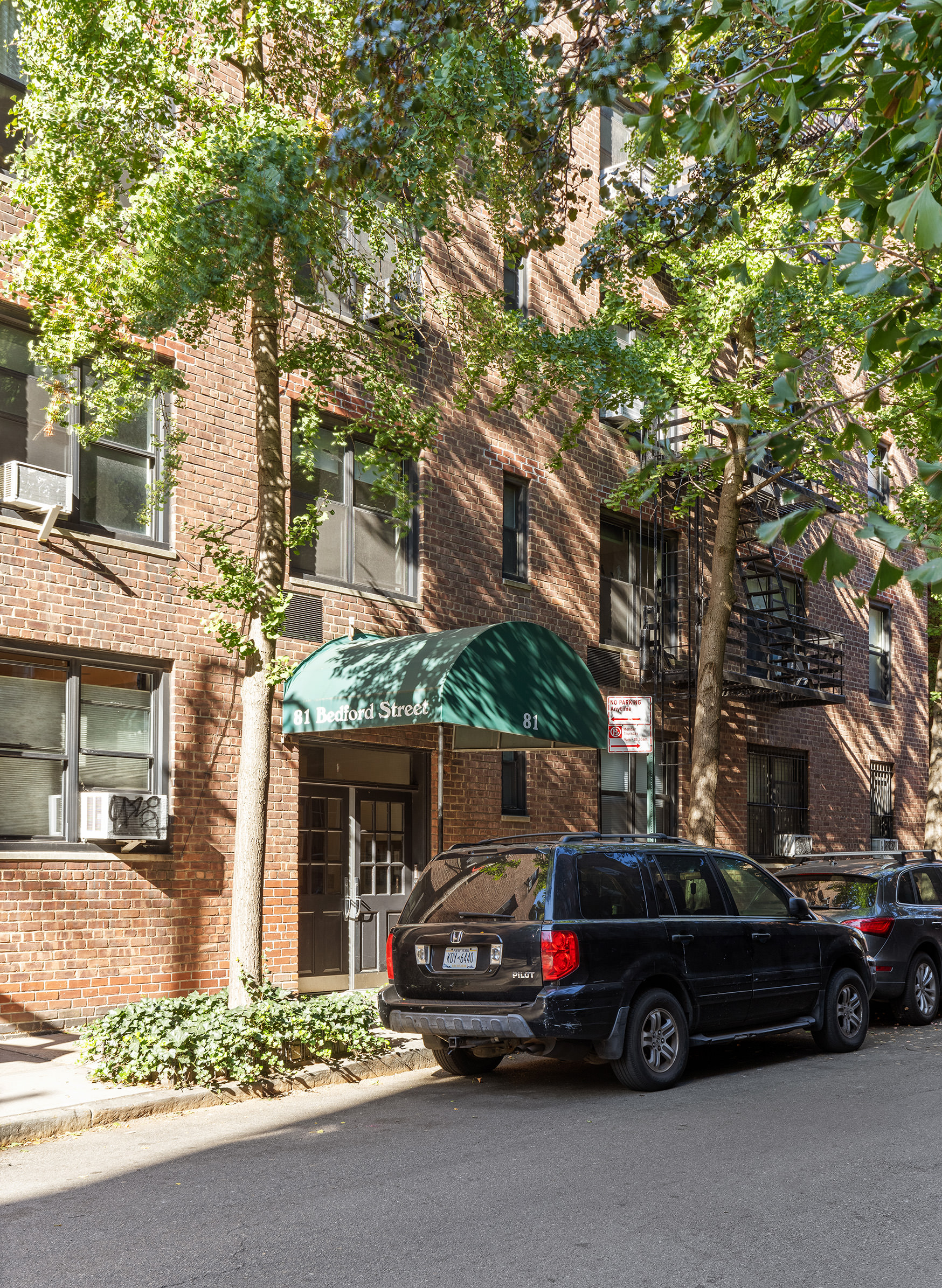 81 Bedford Street, Unit 4B Manhattan, NY 10014 - Photo 14 of 15 a view of a car parked in front of a building