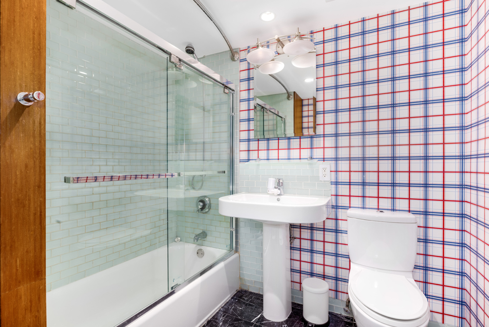 308 West 19th Street, Unit GARDEN Manhattan, NY 10011 - Photo 16 of 18 a bathroom with a sink toilet and shower