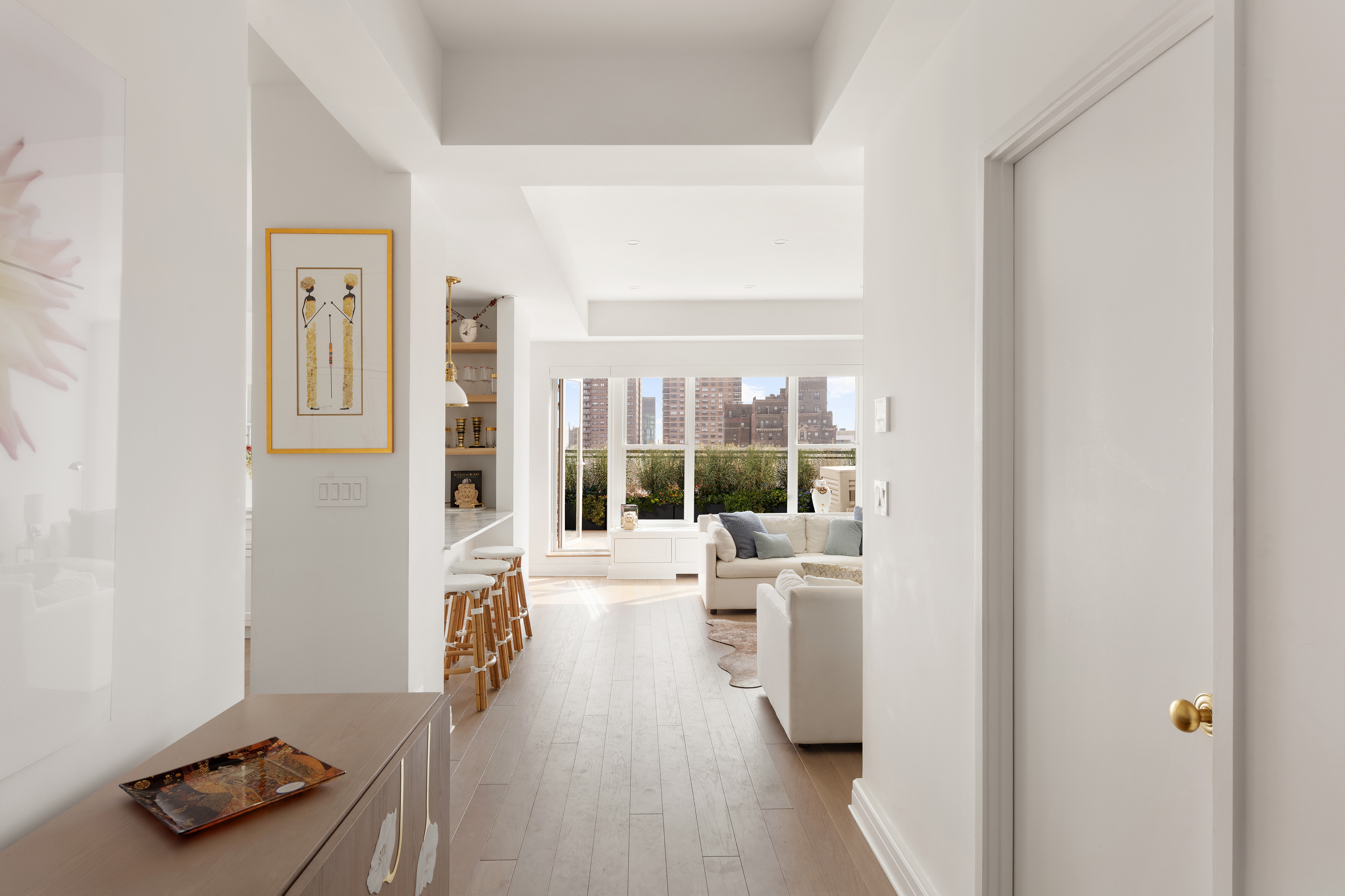 2 5th Avenue, Unit PHC Manhattan, NY 10011 - Photo 2 of 13 a living room with furniture and a large window