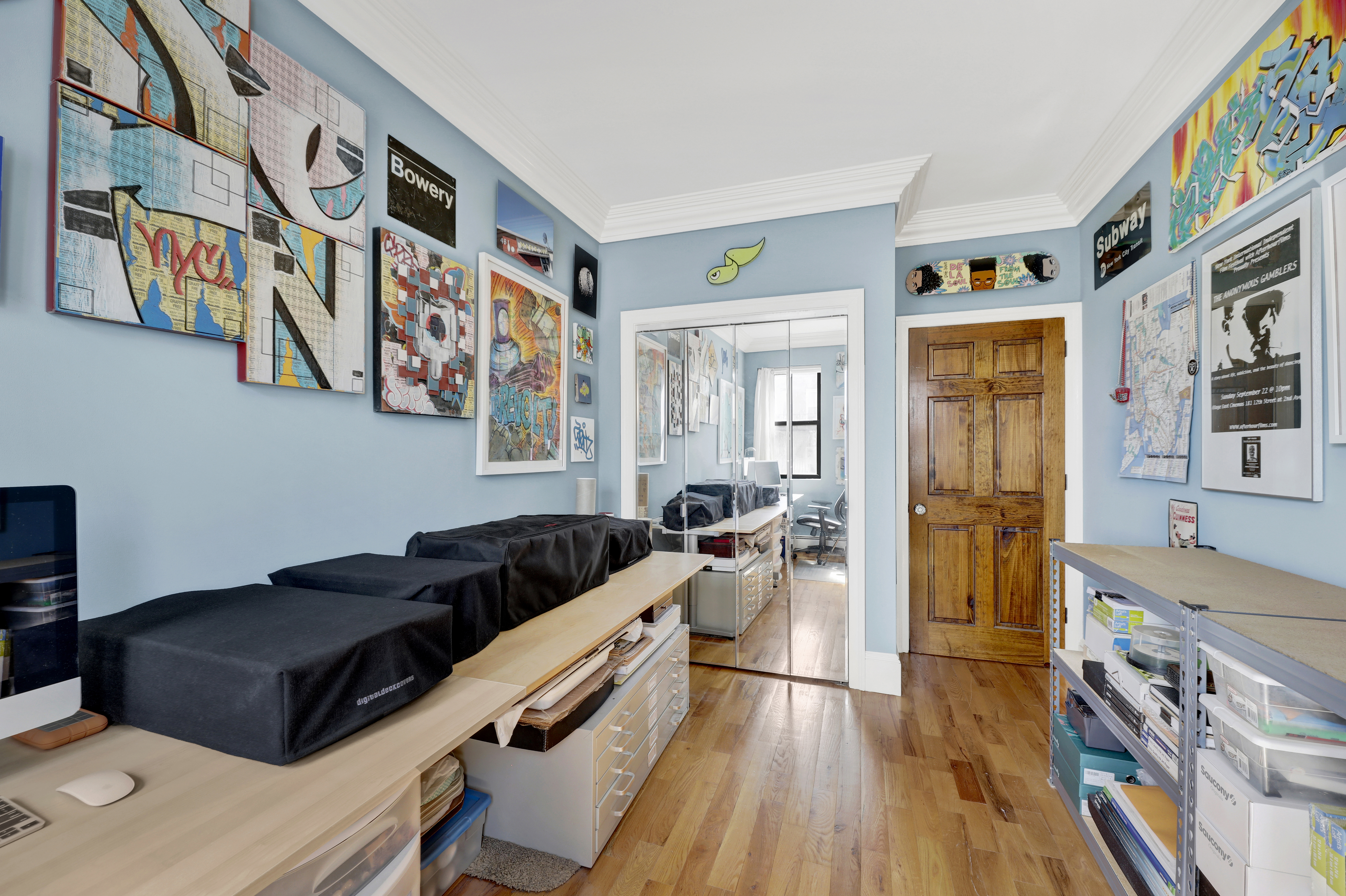 36 Russell Street, Unit 22 Brooklyn, NY 11222 - Photo 25 of 27 a living room with furniture and paintings on the wall