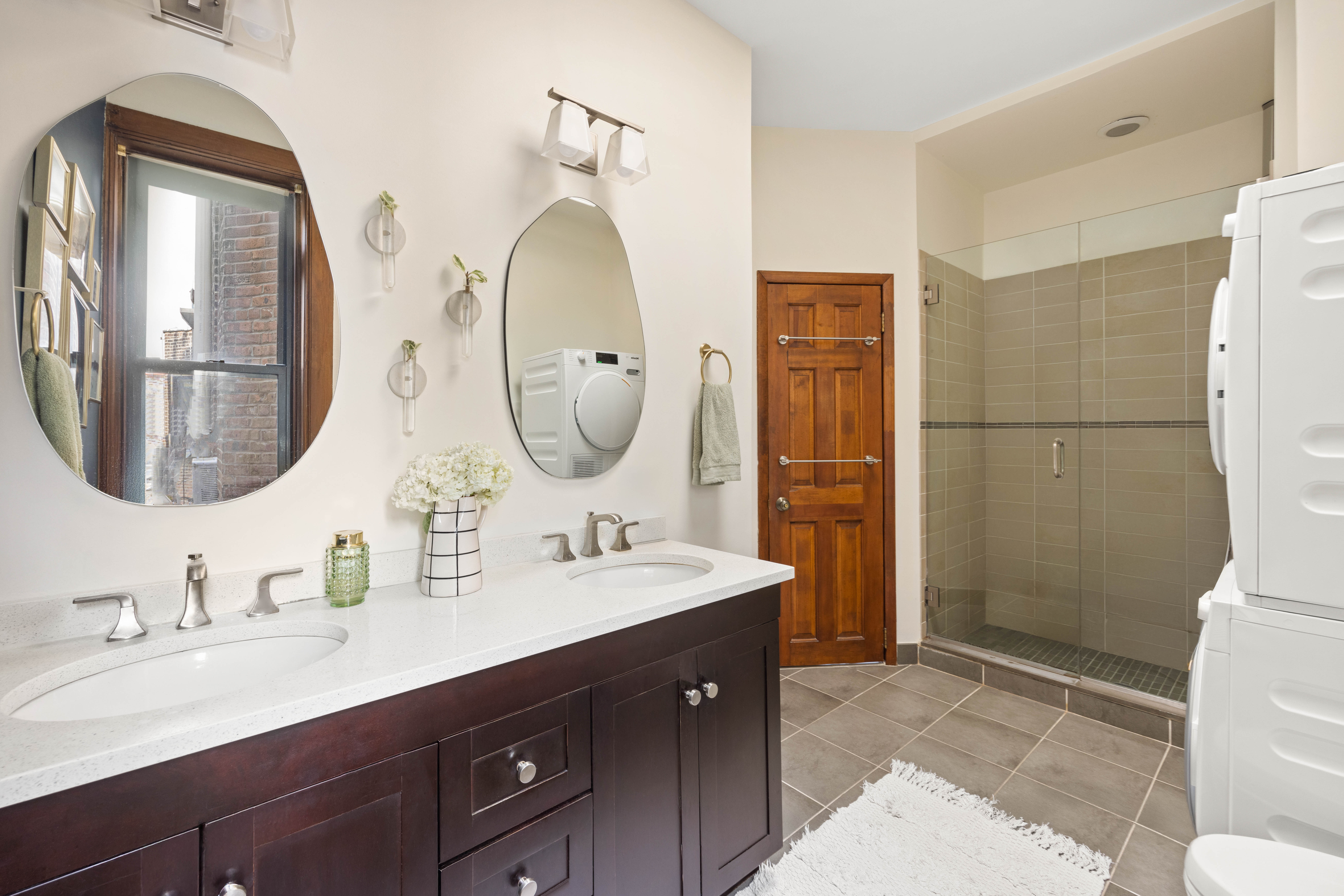 240 Prospect Place, Unit 9 Brooklyn, NY 11238 - Photo 7 of 11 a bathroom with a double vanity sink mirror and toilet