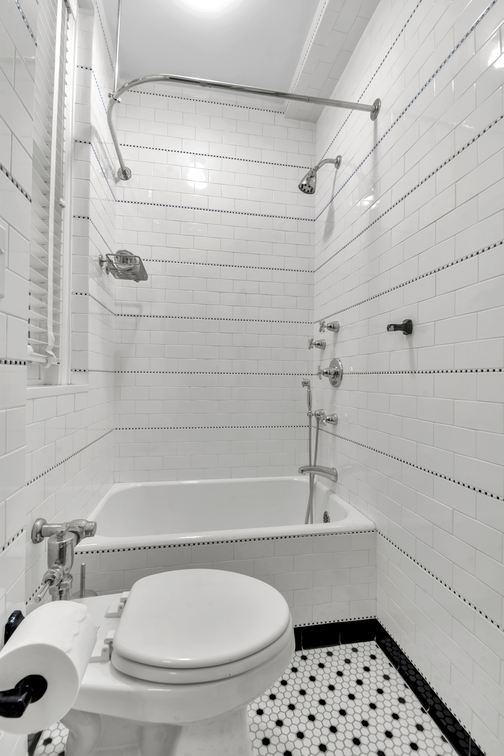 7 Gracie Square, Unit 5A Manhattan, NY 10128 - Photo 22 of 26 a bathroom with a sink a toilet and shower