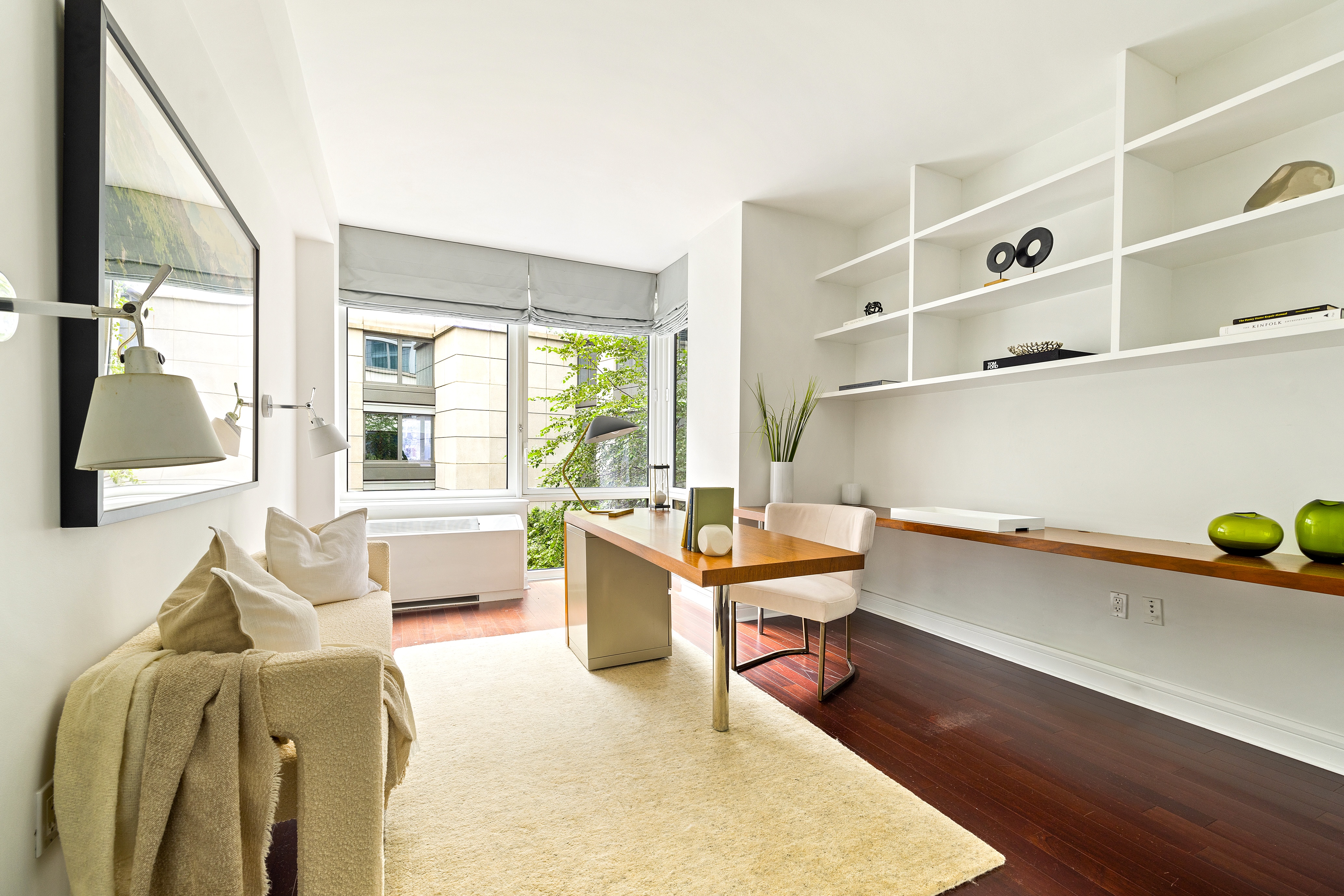 80 Riverside Boulevard, Unit 6B/L Manhattan, NY 10069 - Photo 9 of 17 a living room with furniture and a window