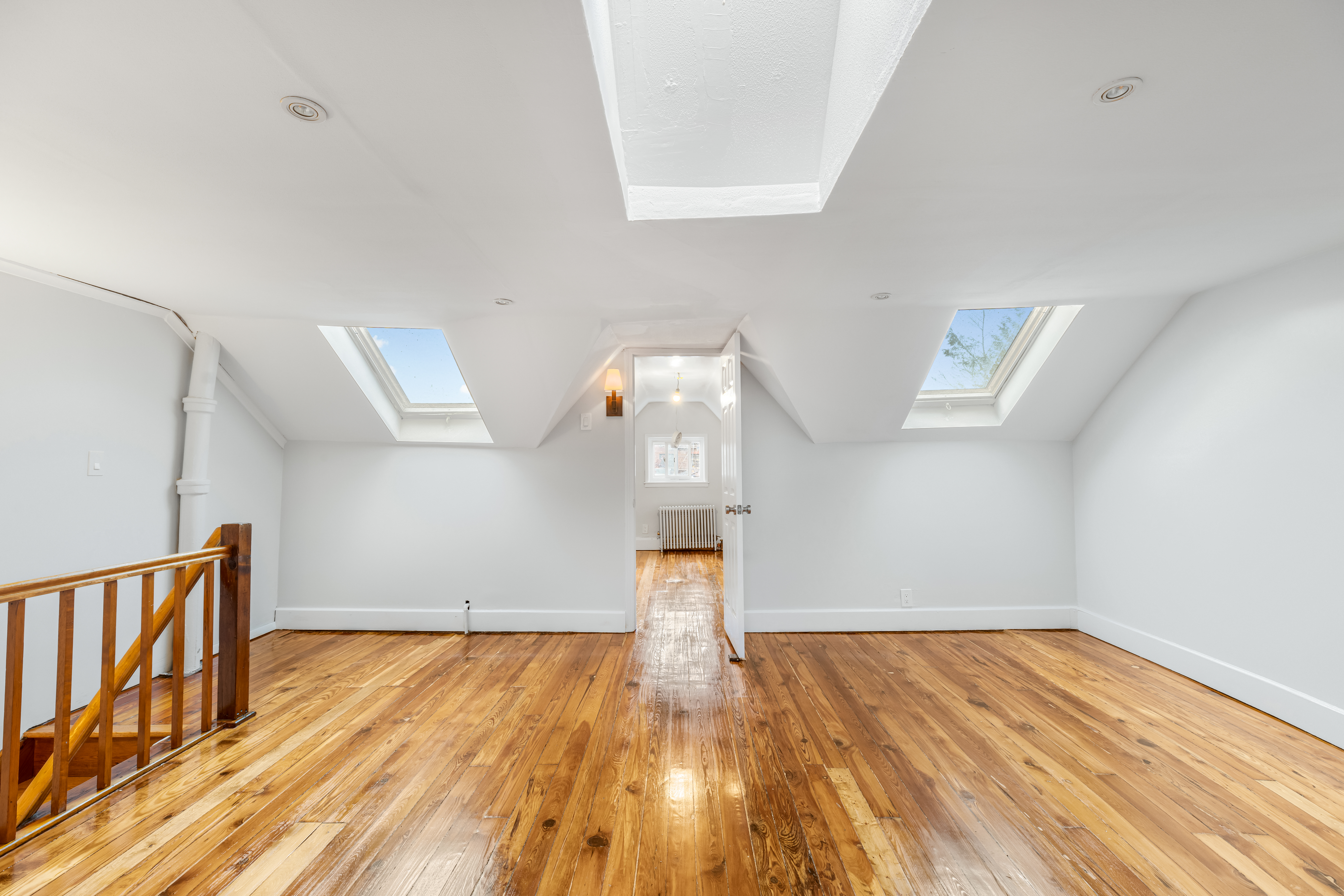 180 East 5th Street, Unit 2 Brooklyn, NY 11218 - Photo 8 of 14 a view of empty room with wooden floor