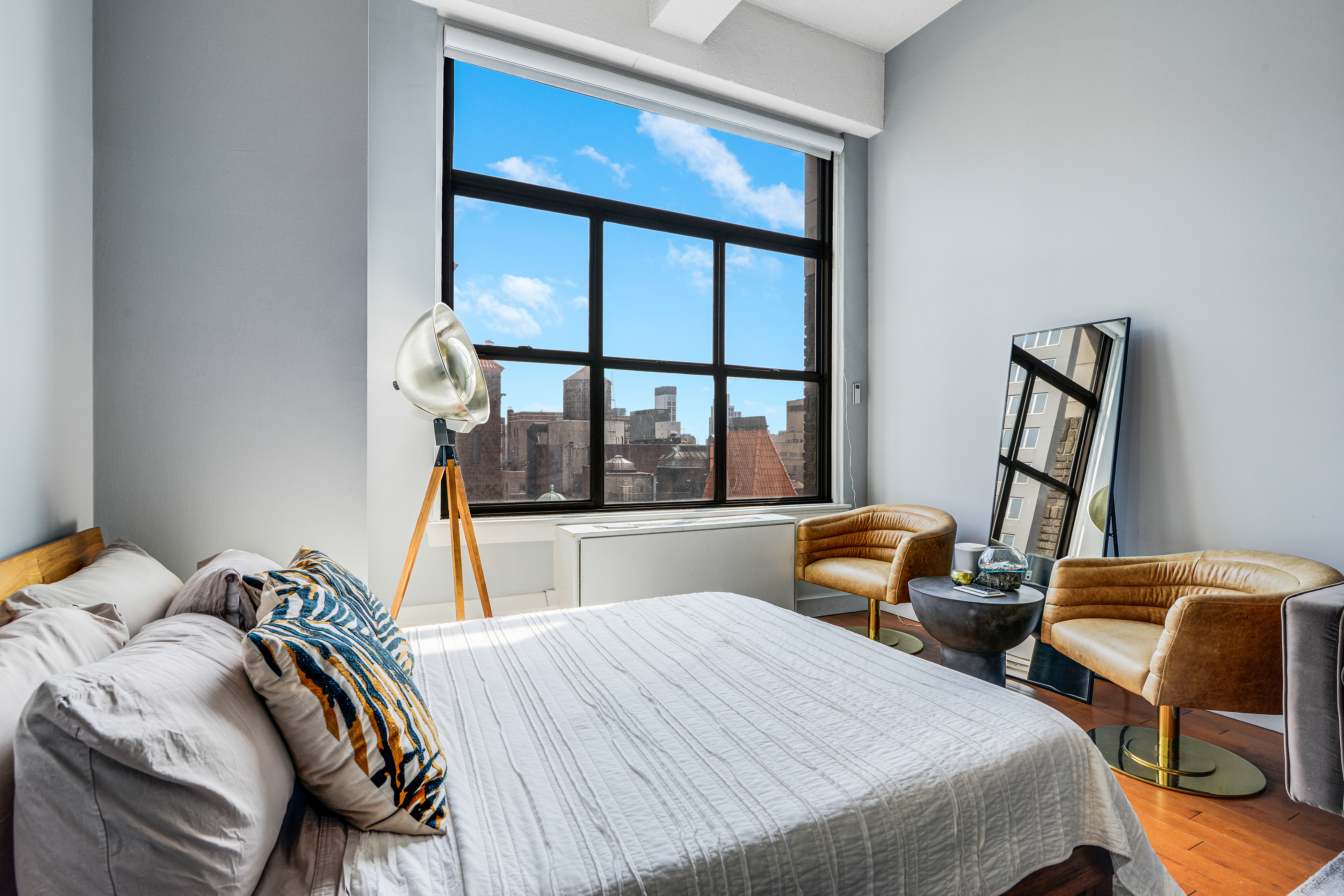 244 Madison Avenue, Unit 15J Manhattan, NY 10016 - Photo 2 of 11 a bedroom with two beds and large window