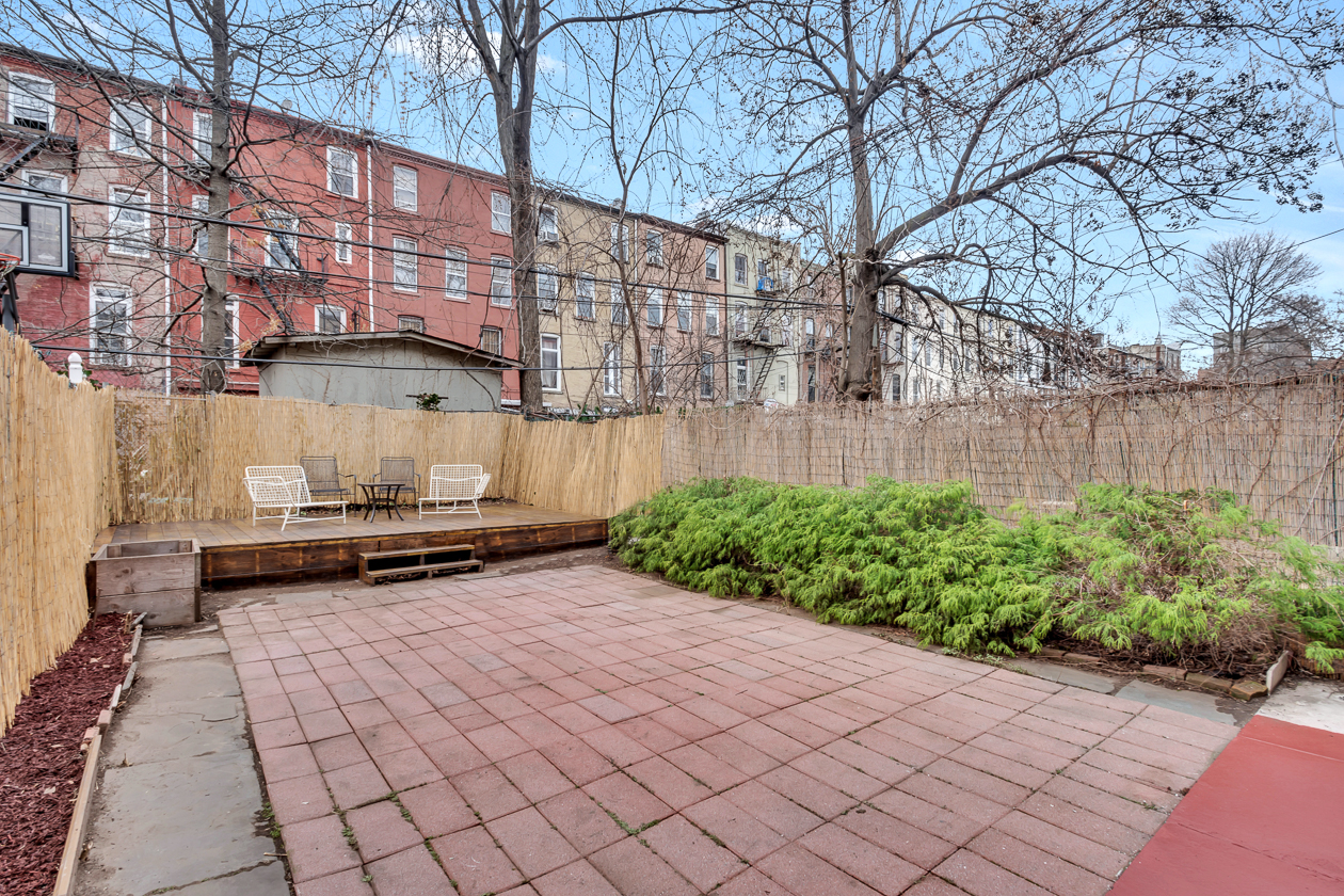 385 Madison Street, Unit 1 Brooklyn, NY 11221 - Photo 10 of 21 a wooden bench sitting in front of a building