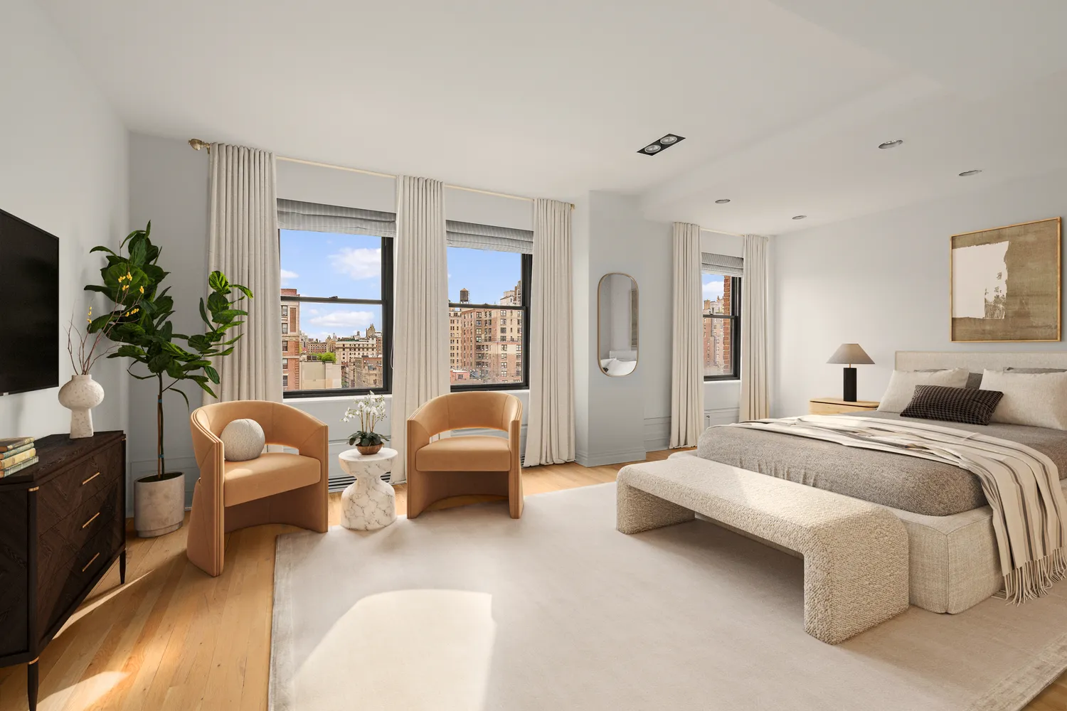 a spacious bedroom with a bed and a couch