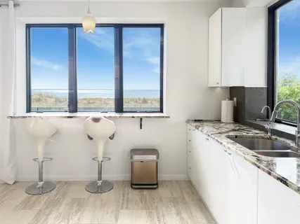 a kitchen with a sink and a window