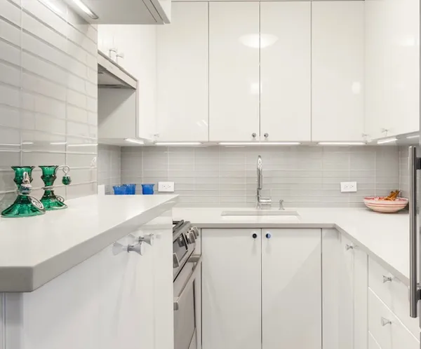 a kitchen with appliances cabinets and a sink