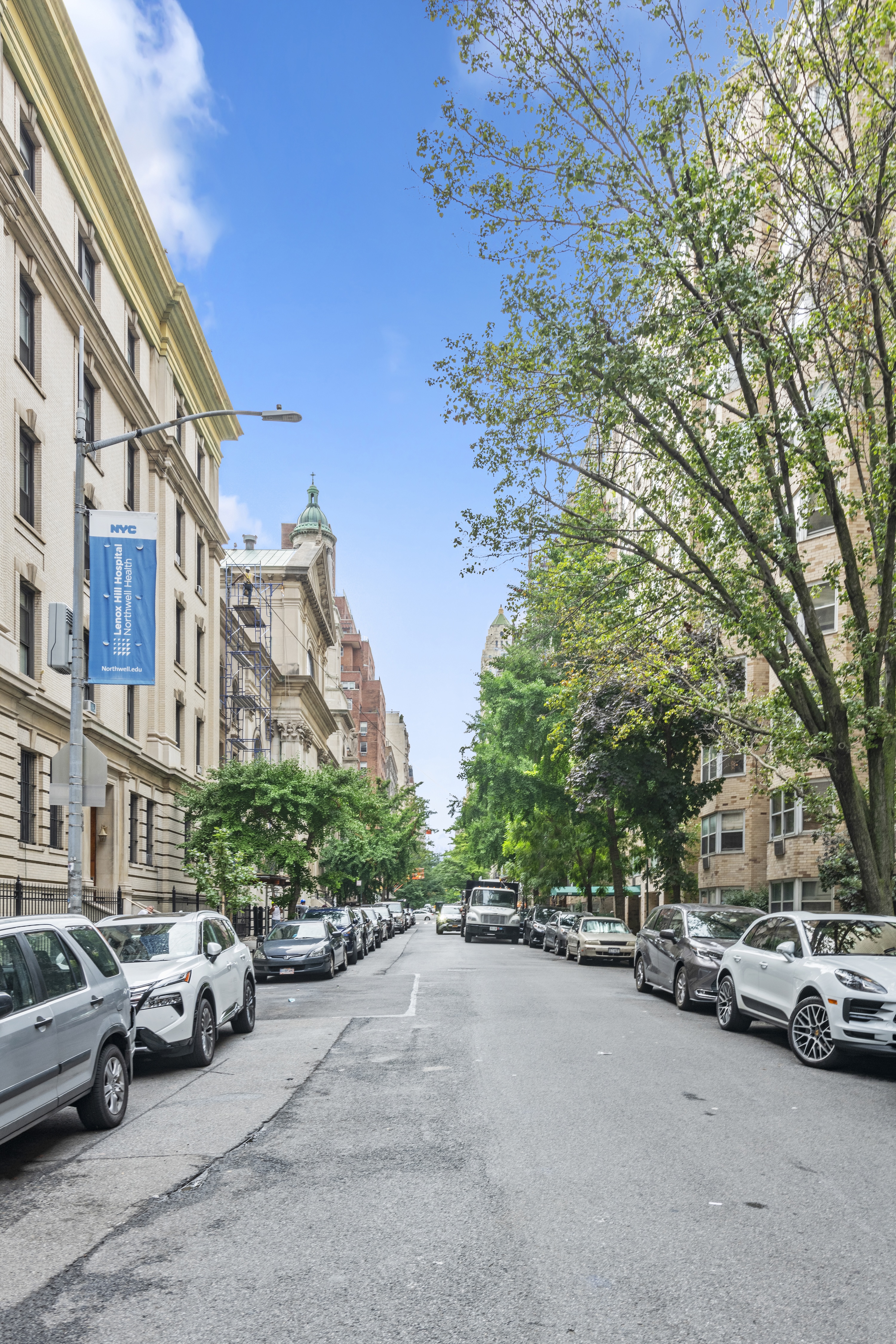 195 East 76th Street Manhattan, NY 10021 - Photo 19 of 20 a view of street with parked cars