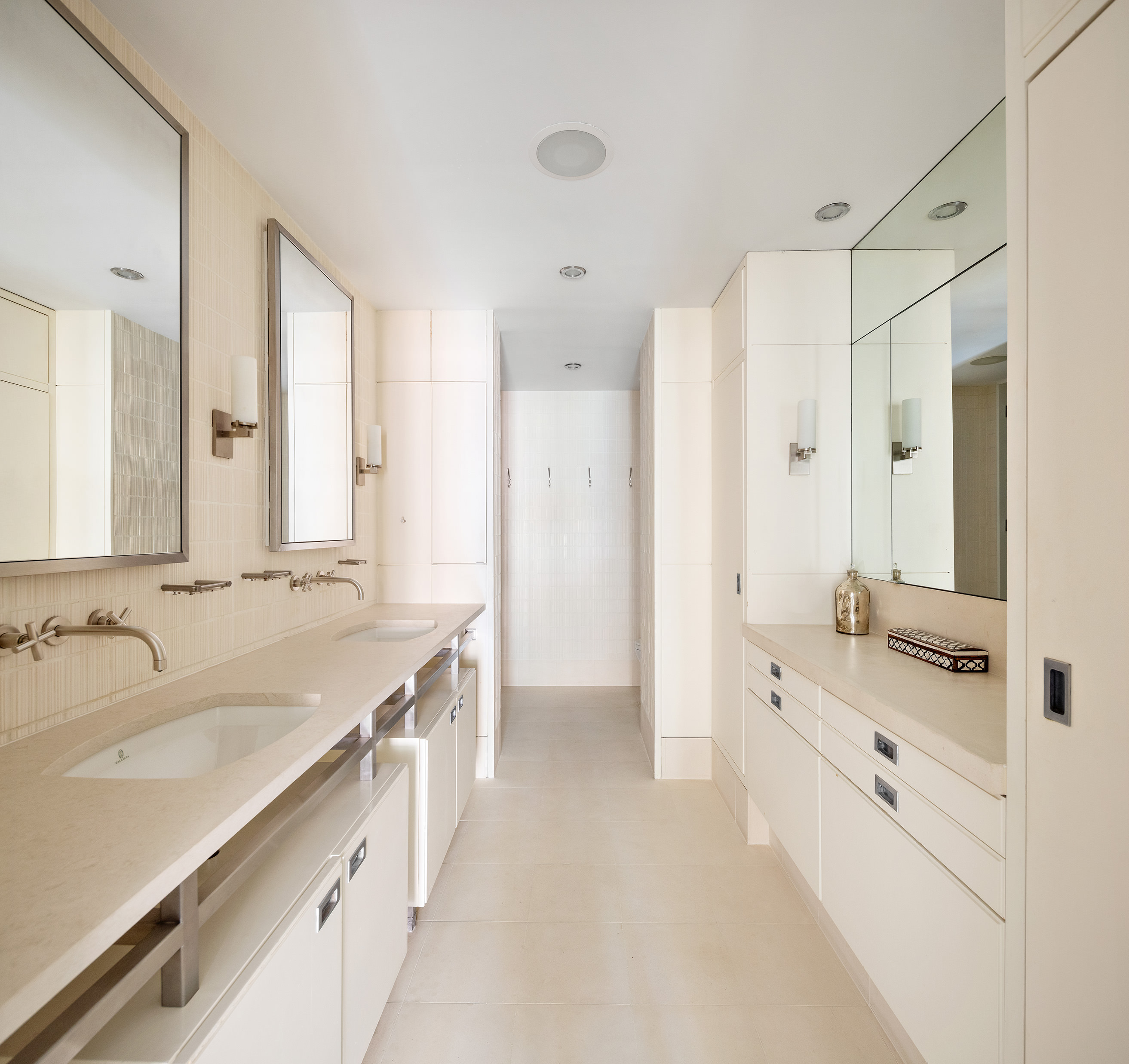 27 North Moore Street, Unit 10D Manhattan, NY 10013 - Photo 18 of 30 a large bathroom with a granite countertop double vanity sink a mirror and a bathtub