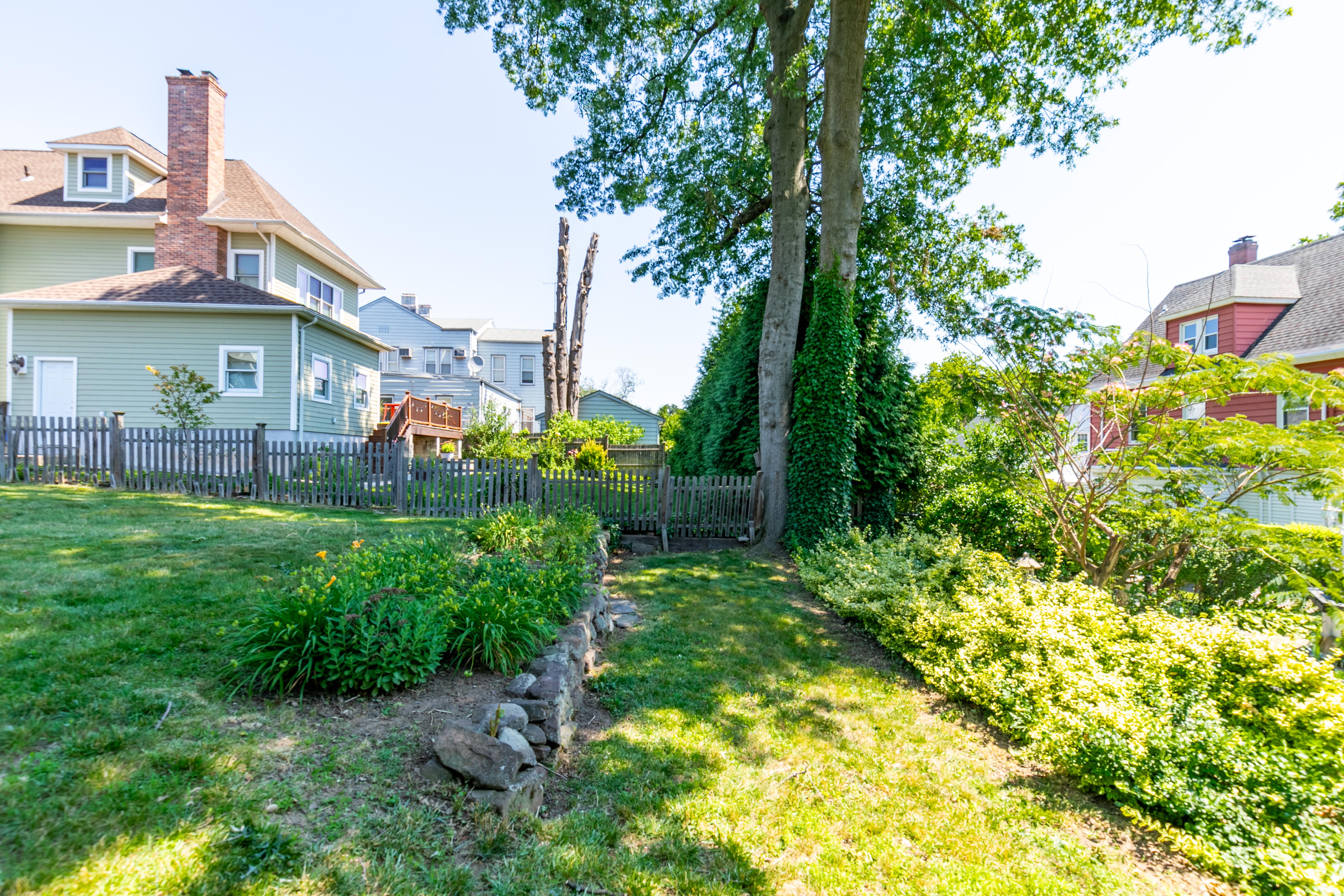163 Ridge Road Rutherford, NJ 07070 - Photo 46 of 59 a view of a yard in front of house