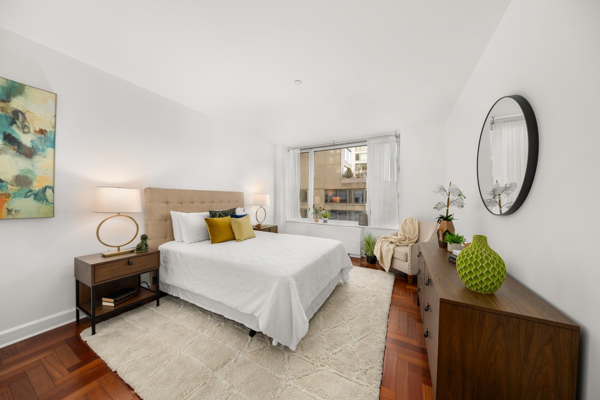 220 Riverside Boulevard, Unit 15C Manhattan, NY 10069 - Photo 4 of 10 a bedroom with bed and a window