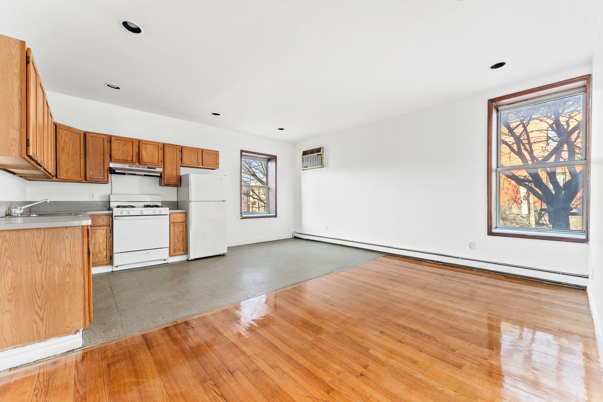 a kitchen with stainless steel appliances granite countertop a refrigerator and a stove top oven