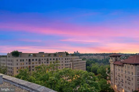 a view of a balcony with wooden floor