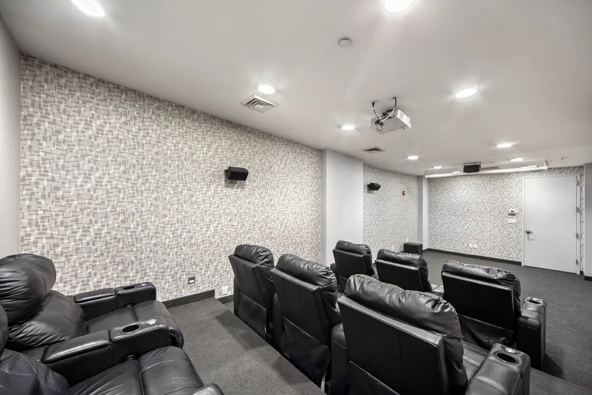 a backyard of a house with table and chairs wooden floor and fence