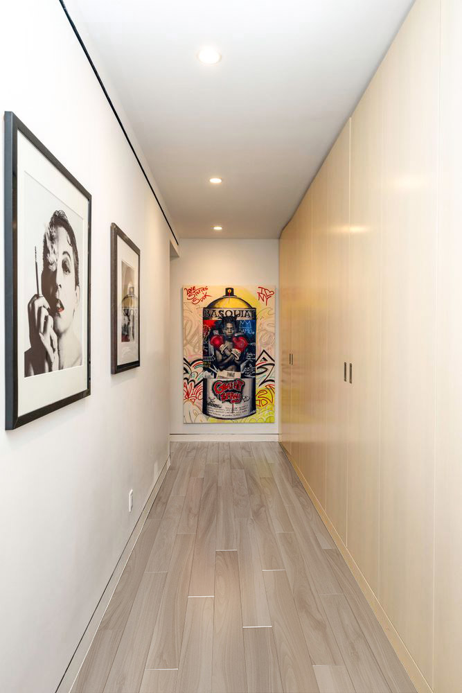 40 East 62nd Street, Unit 8E Manhattan, NY 10065 - Photo 12 of 24 a view of a hallway with wooden floor