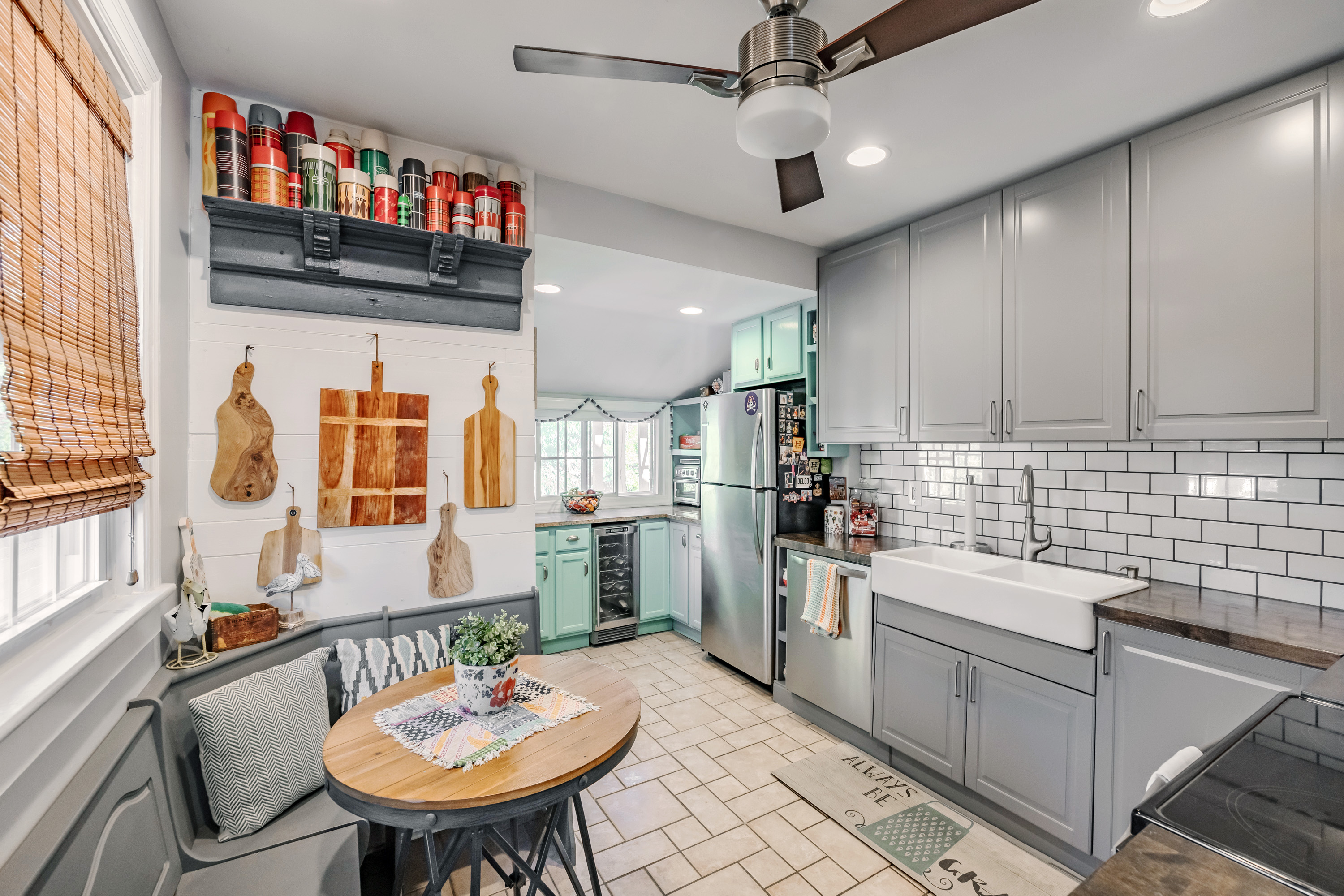 134 Strathmore Road Havertown, PA 19083 - Photo 22 of 64 a kitchen with stainless steel appliances kitchen island granite countertop a sink dishwasher a stove a dining table and chairs with wooden floor