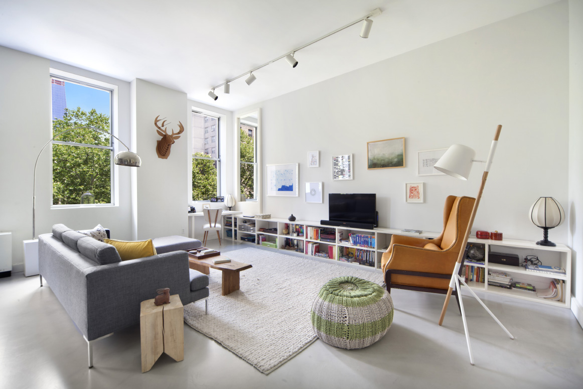 420 West 25th Street, Unit 3B Manhattan, NY 10001 - Photo 2 of 15 a living room with furniture and a large window