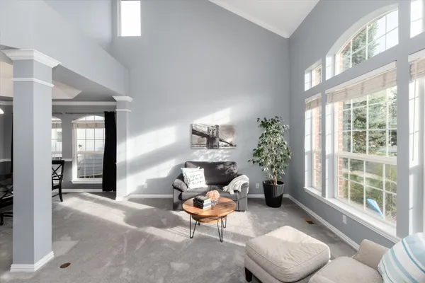 a view of a livingroom with furniture and a workspace