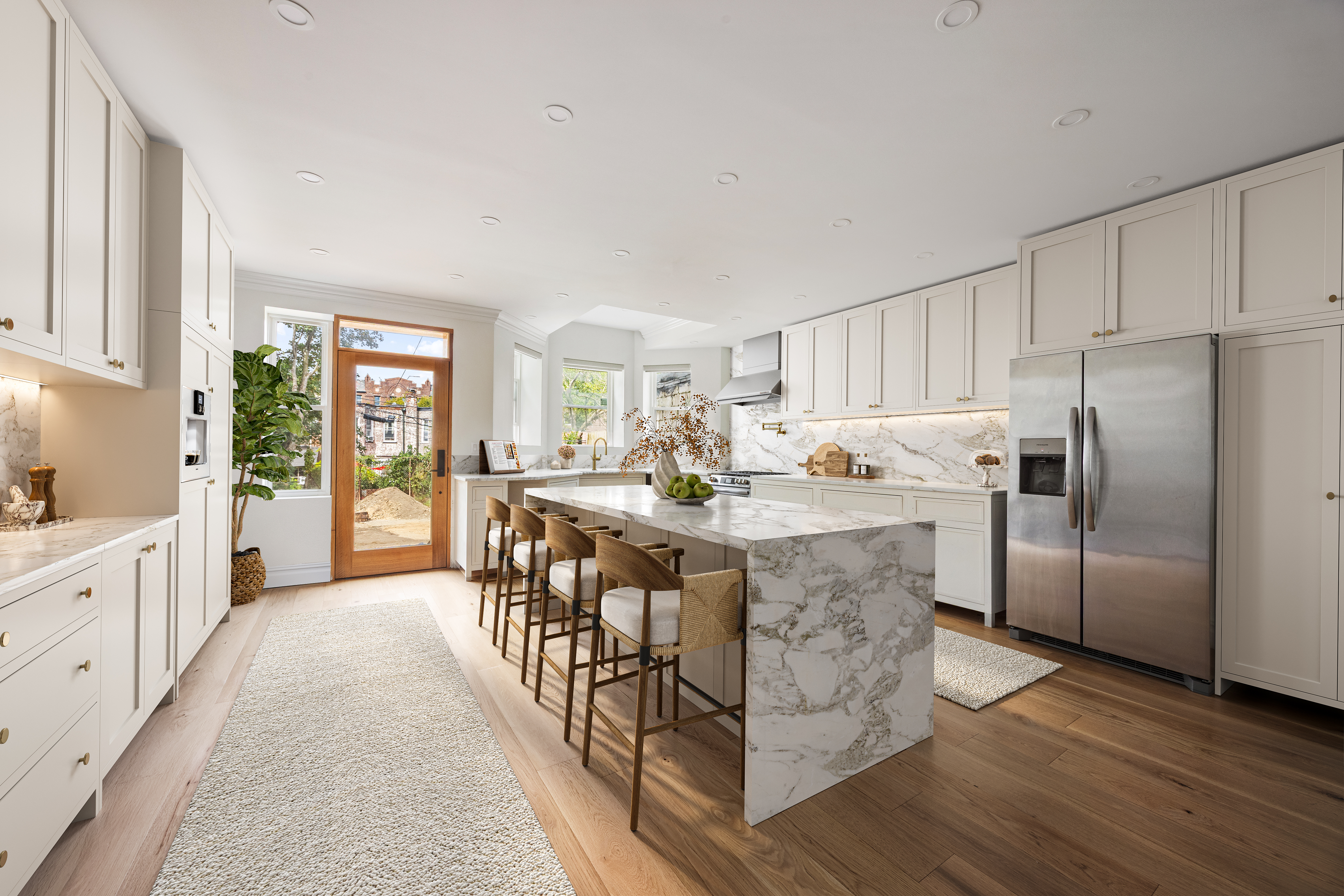 1423 Park Place Brooklyn, NY 11213 - Photo 3 of 17 a kitchen with stainless steel appliances granite countertop a stove a refrigerator a sink a dining table and chairs with wooden floor