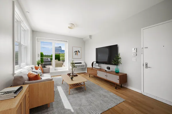 a kitchen with a sink and wooden floor
