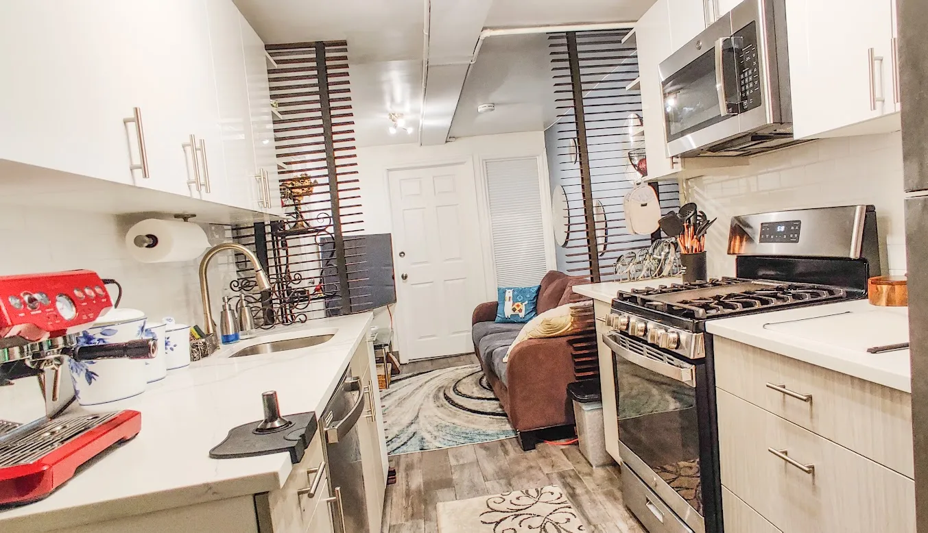 a kitchen with a sink and cabinets