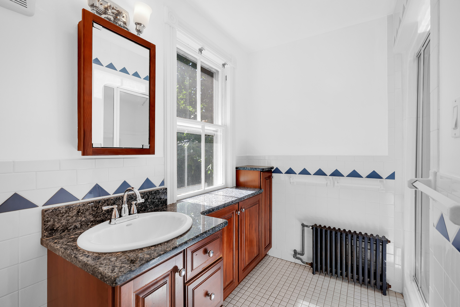242-09 Pine Street Queens, NY 11363 - Photo 12 of 21 a bathroom with a granite countertop sink and a mirror