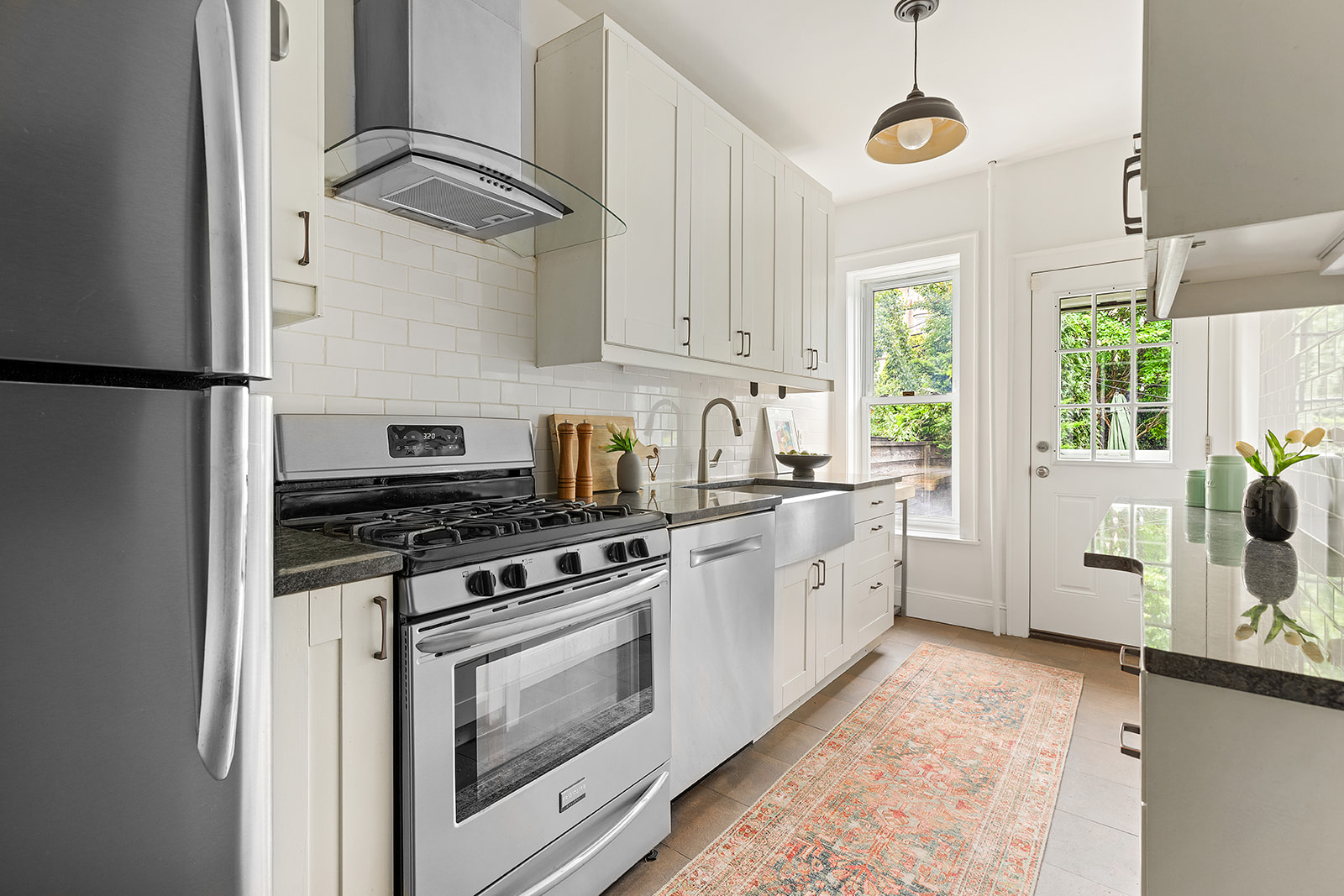 203 Lefferts Avenue Brooklyn, NY 11225 - Photo 6 of 12 a kitchen with stainless steel appliances granite countertop a stove a sink and a refrigerator