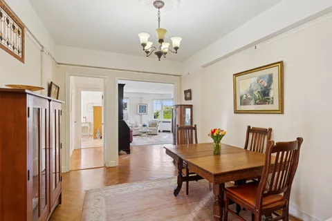 a dining room with furniture and window