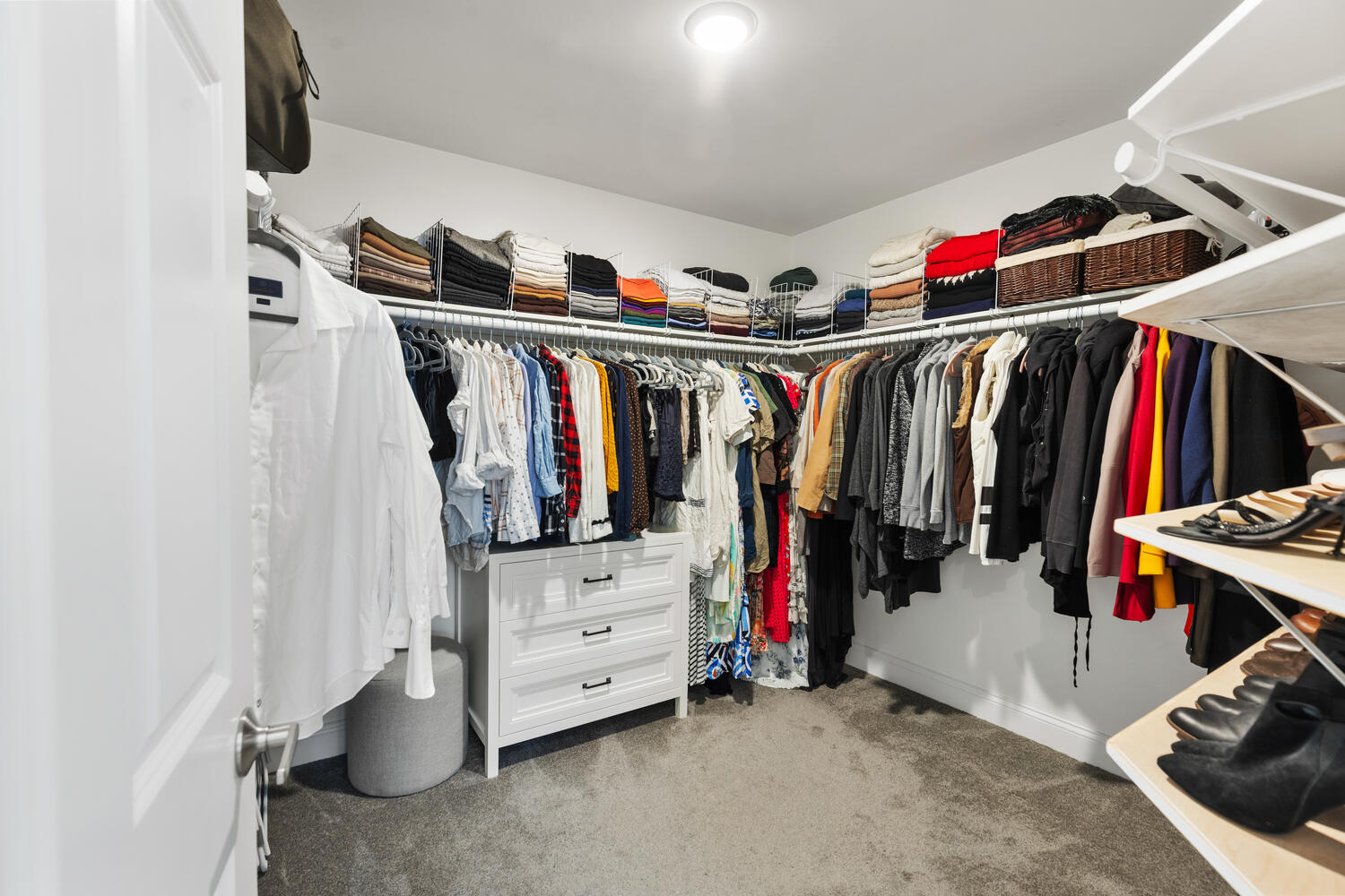1 Maple Street, Unit 1 Maynard, MA 01754 - Photo 27 of 42 a view of walk in closet with clothes and shoes
