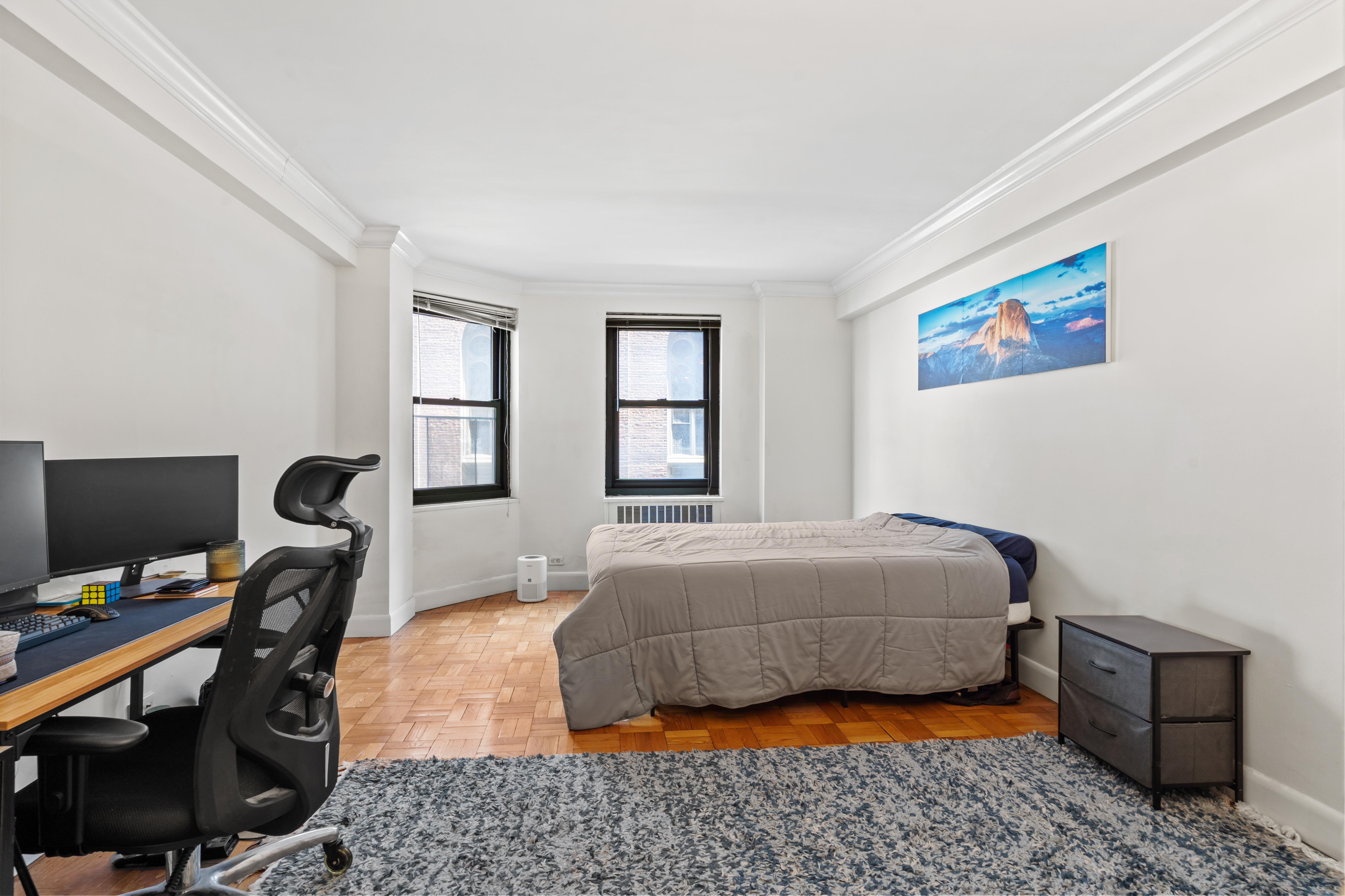 135 East 54th Street, Unit 3H Manhattan, NY 10022 - Photo 3 of 7 a bedroom with a bed and a window