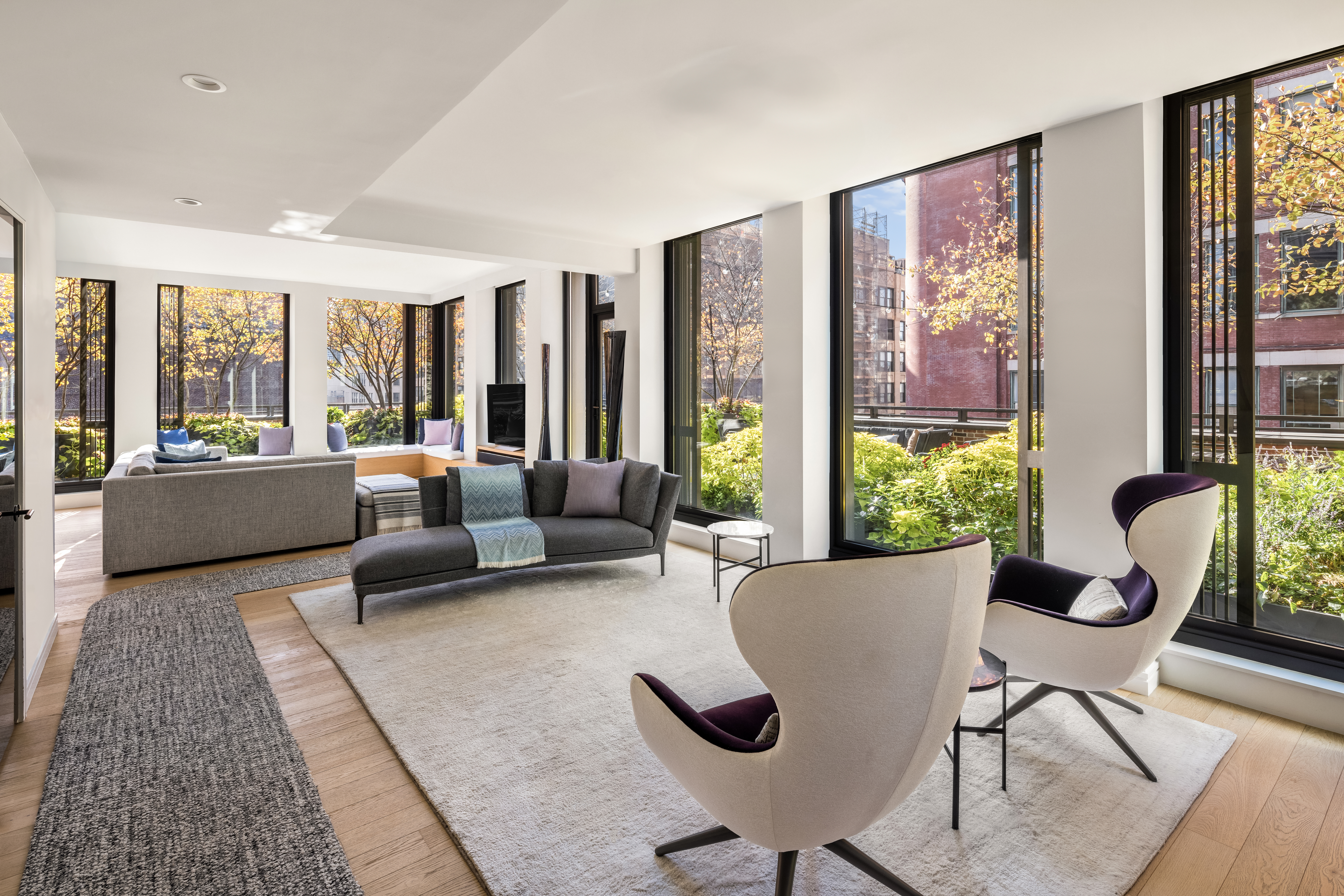 100 Barrow Street, Unit 7/8A Manhattan, NY 10014 - Photo 5 of 23 a living room with furniture and a large window