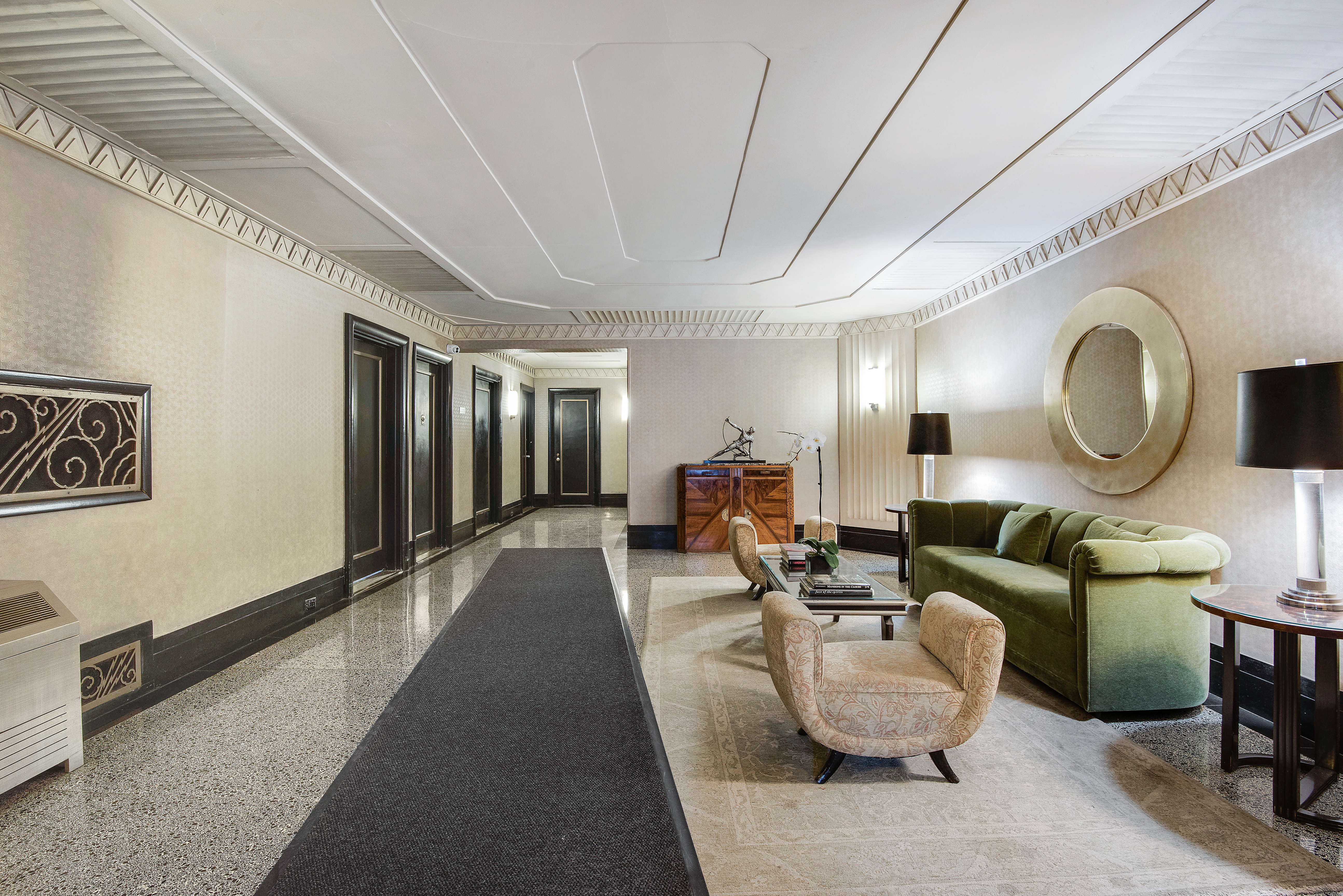 434 East 52nd Street, Unit 1BH Manhattan, NY 10022 - Photo 19 of 23 a living room with furniture a mirror and a large window