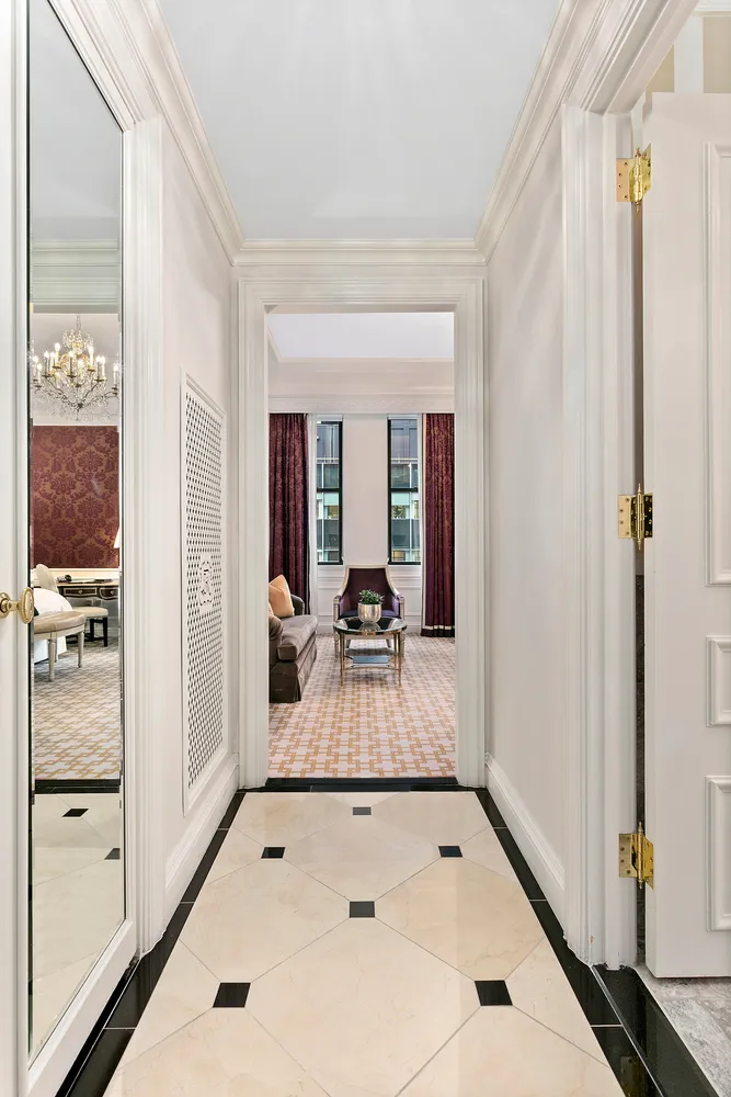 a very nice looking room with a large window and chandelier