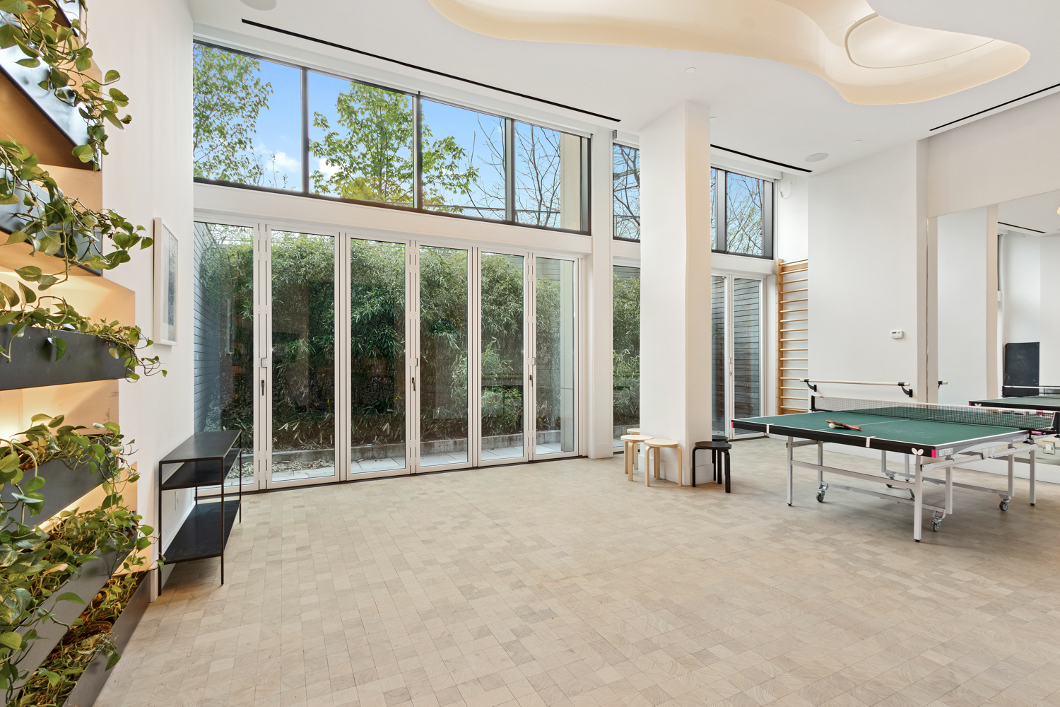 130 Furman Street, Unit S102 Brooklyn, NY 11201 - Photo 18 of 26 wooden floor to ceiling windows and painting on the wall