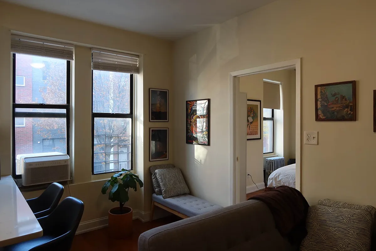 56 Stagg Street, Unit 4 Brooklyn, NY 11206 - Photo 3 of 11 a living room with furniture and two windows