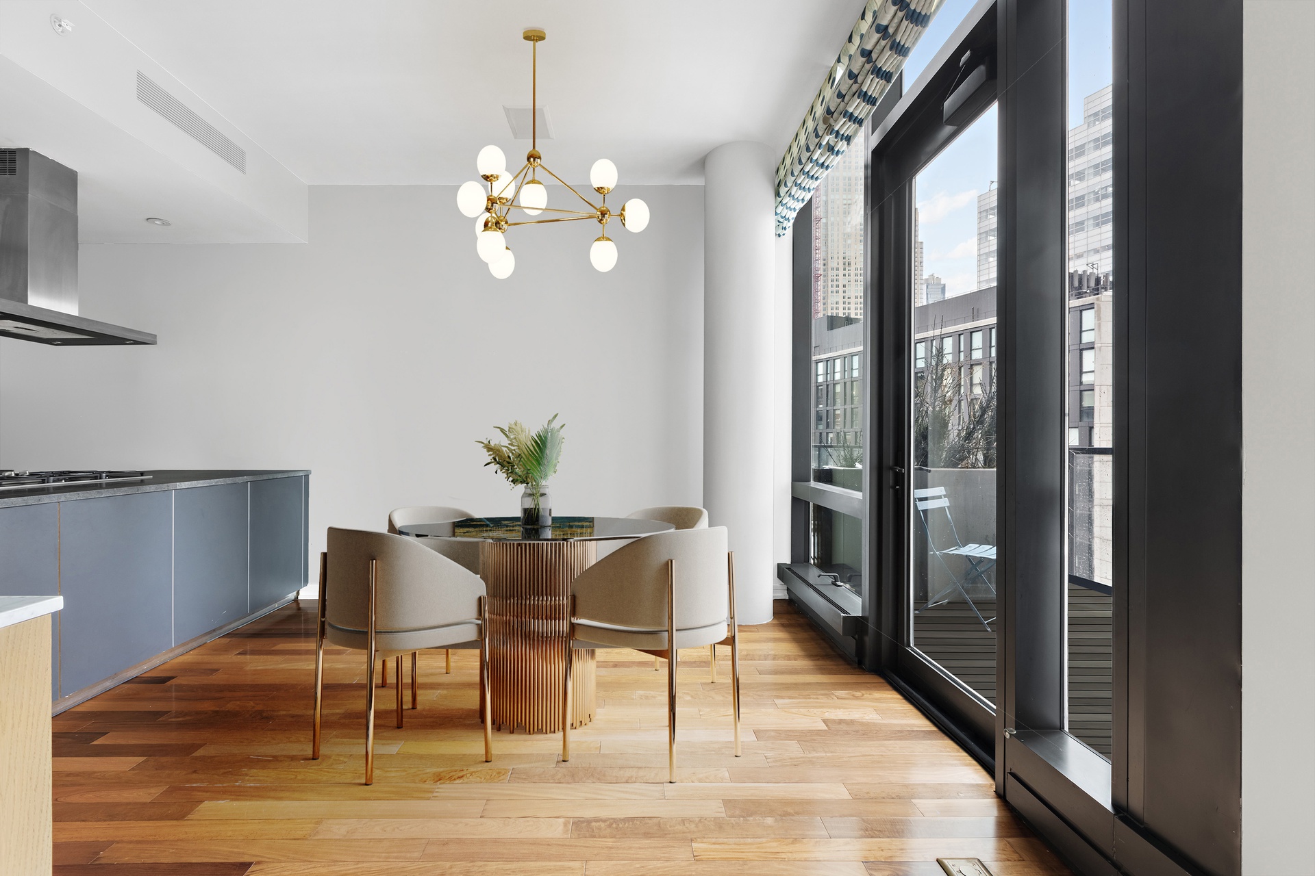 101 Warren Street, Unit 11L Manhattan, NY 10007 - Photo 6 of 26 a view of a dining room with furniture wooden floor and chandelier