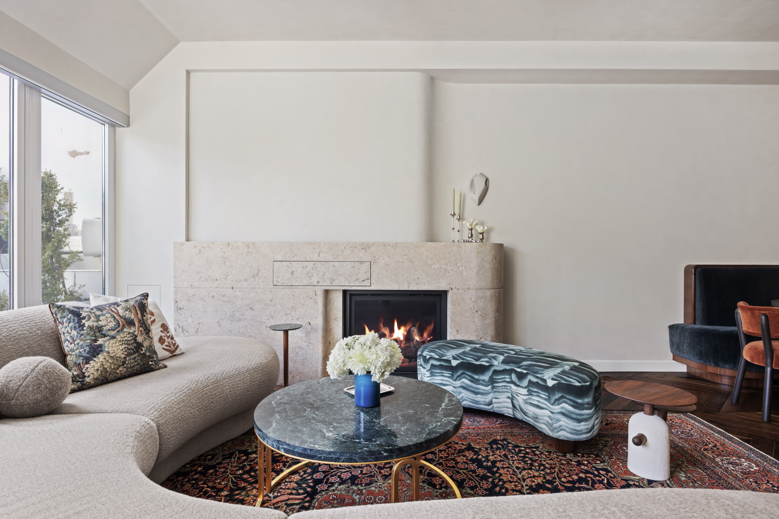 109 Greene Street, Unit PH6A Manhattan, NY 10012 - Photo 4 of 26 a living room with furniture and a fireplace