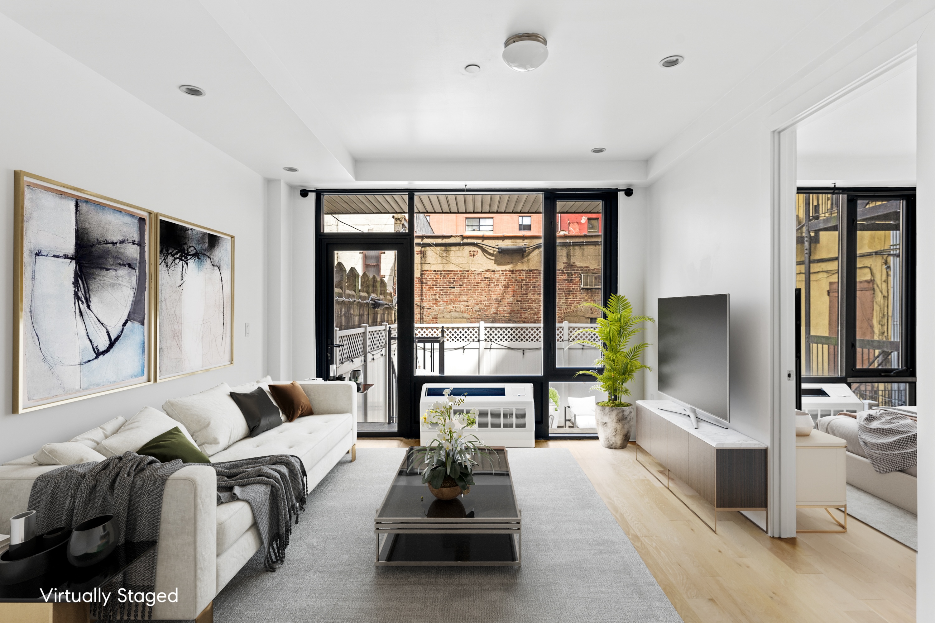399 East 8th Street, Unit 1A Manhattan, NY 10009 - Photo 4 of 13 a living room with furniture large windows and a flat screen tv