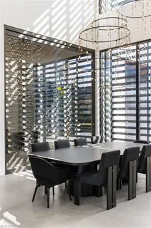 a view of a dining room with furniture and chandelier