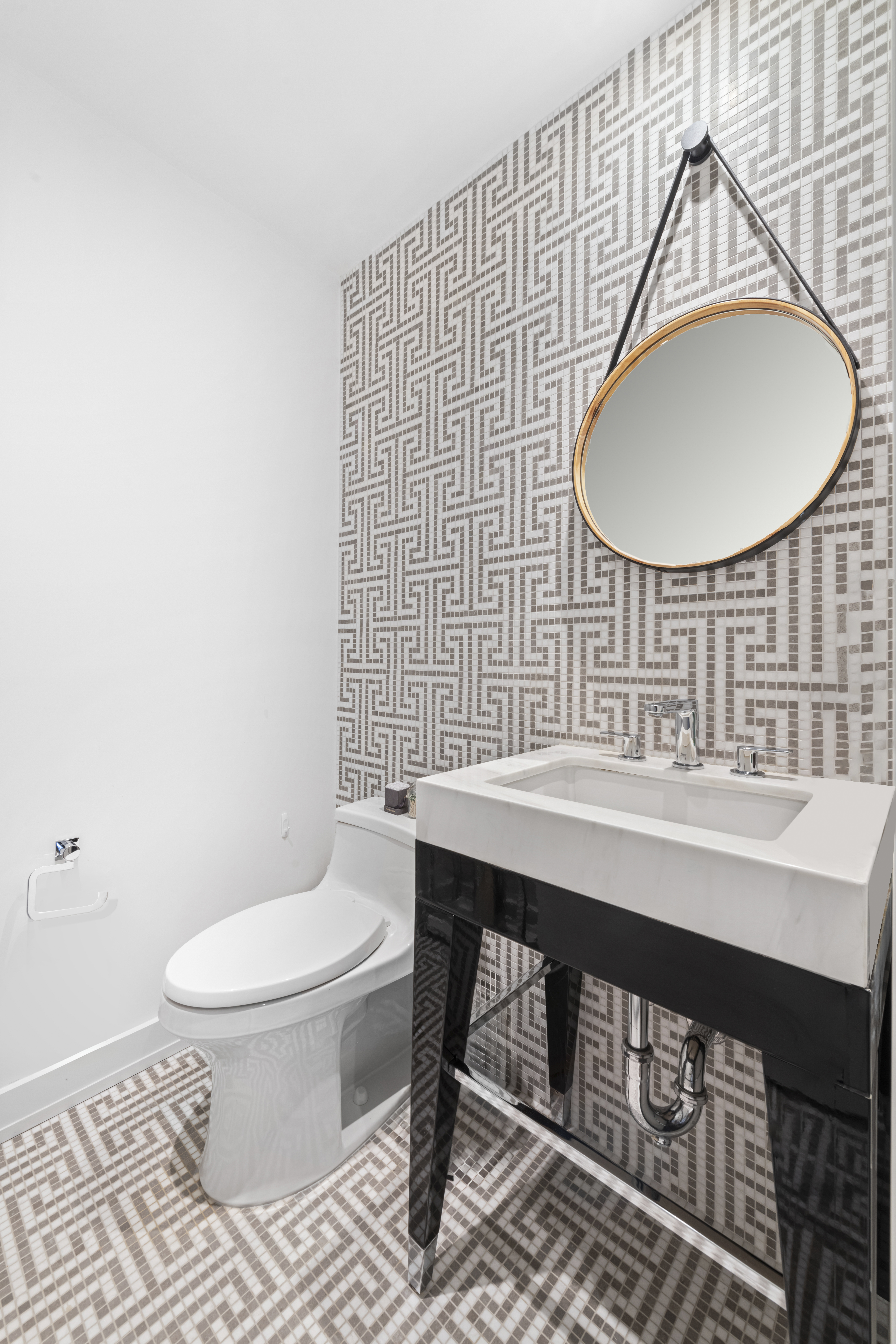 261 West 25th Street, Unit 4D Manhattan, NY 10001 - Photo 11 of 14 a bathroom with a sink a toilet and a mirror