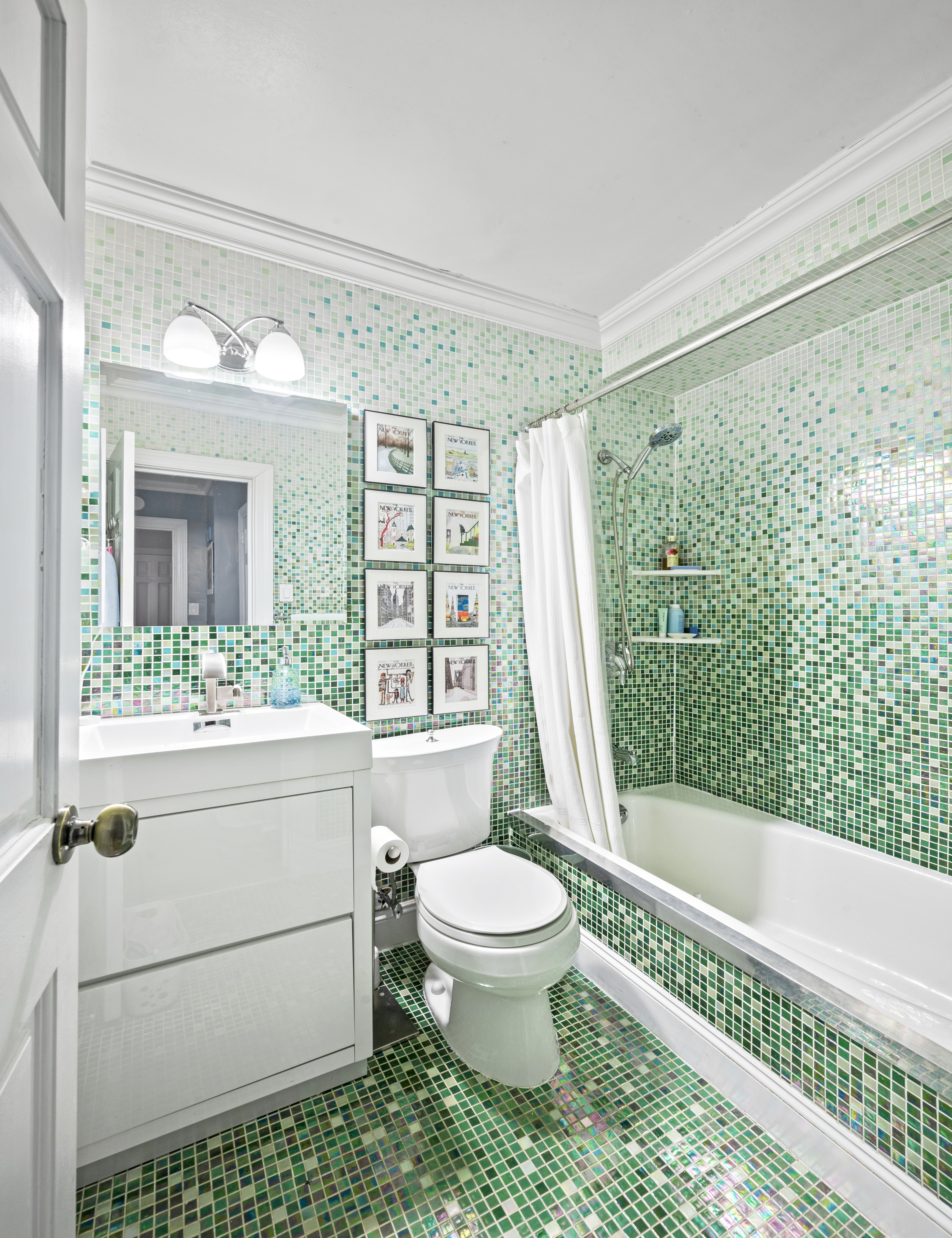 201 East 79th Street, Unit 6A Manhattan, NY 10075 - Photo 7 of 11 a bathroom with a toilet a bath tub and a shower